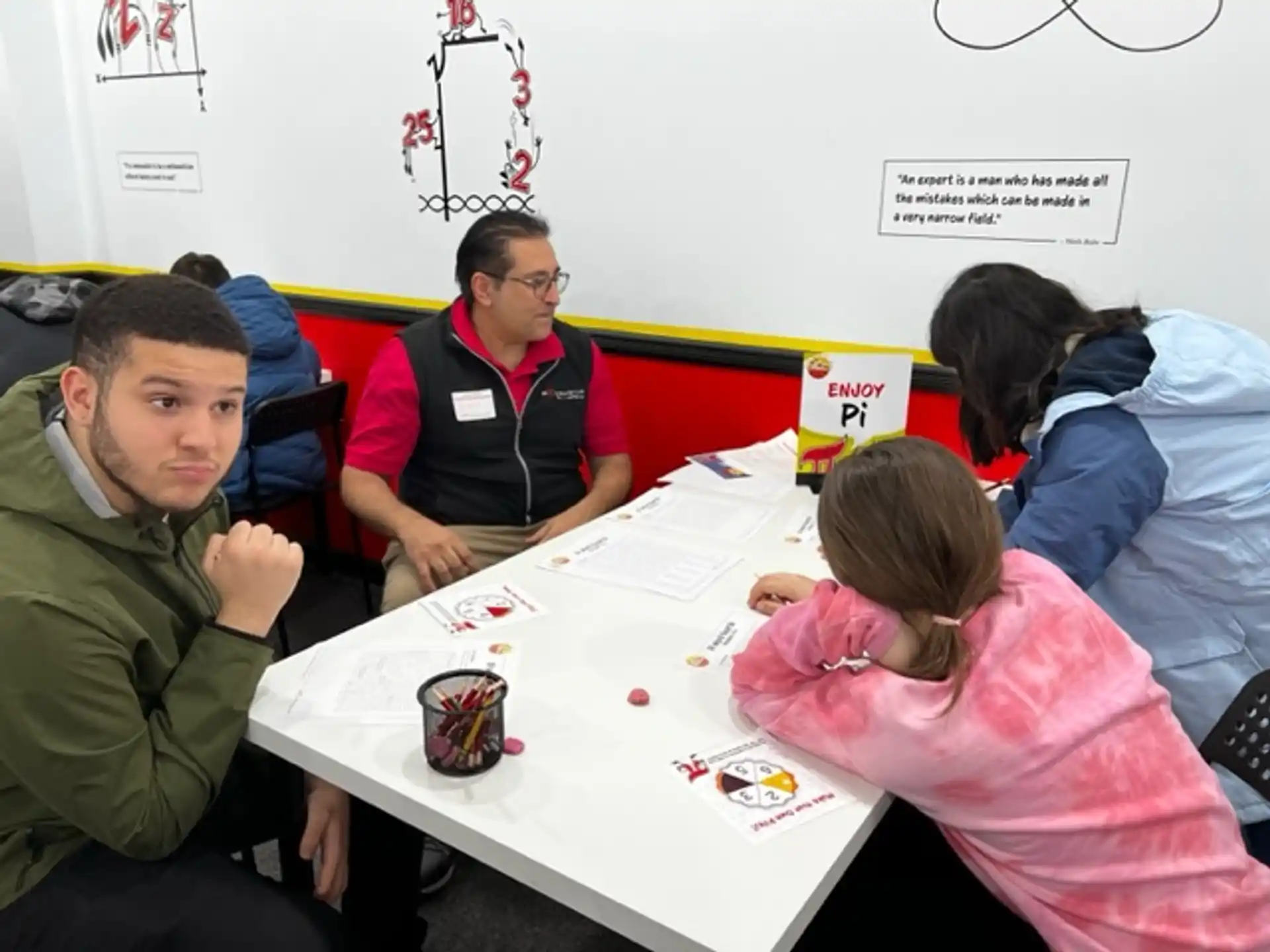 a group of people sitting around a table