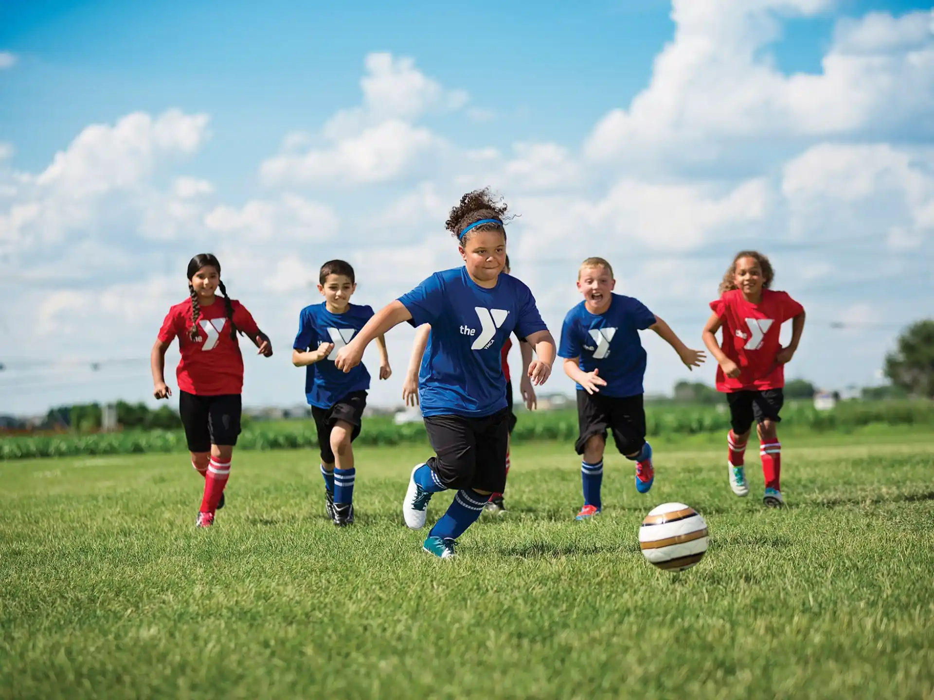 a group of kids playing football