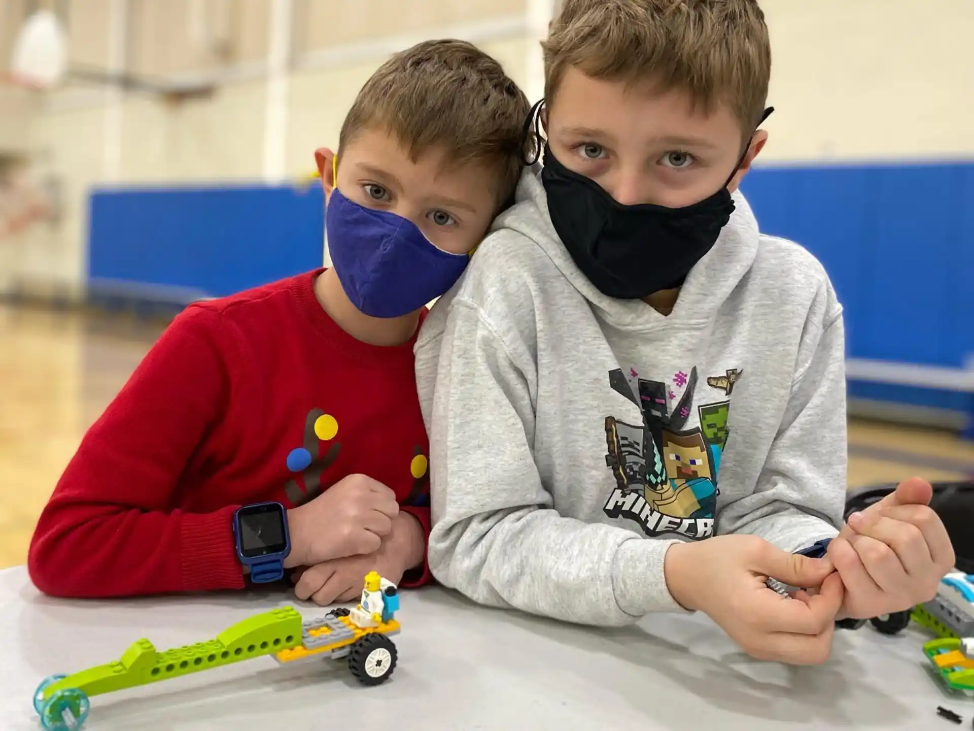a couple of boys playing with toys