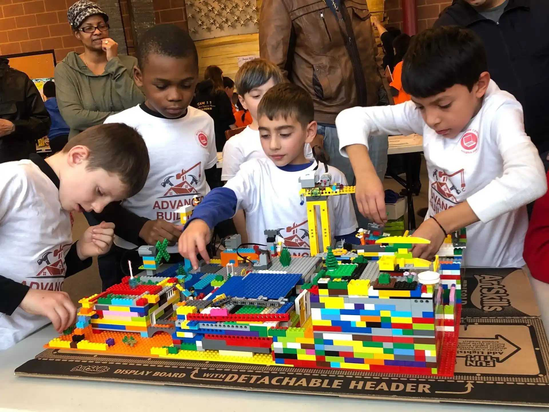 a group of kids playing a board game
