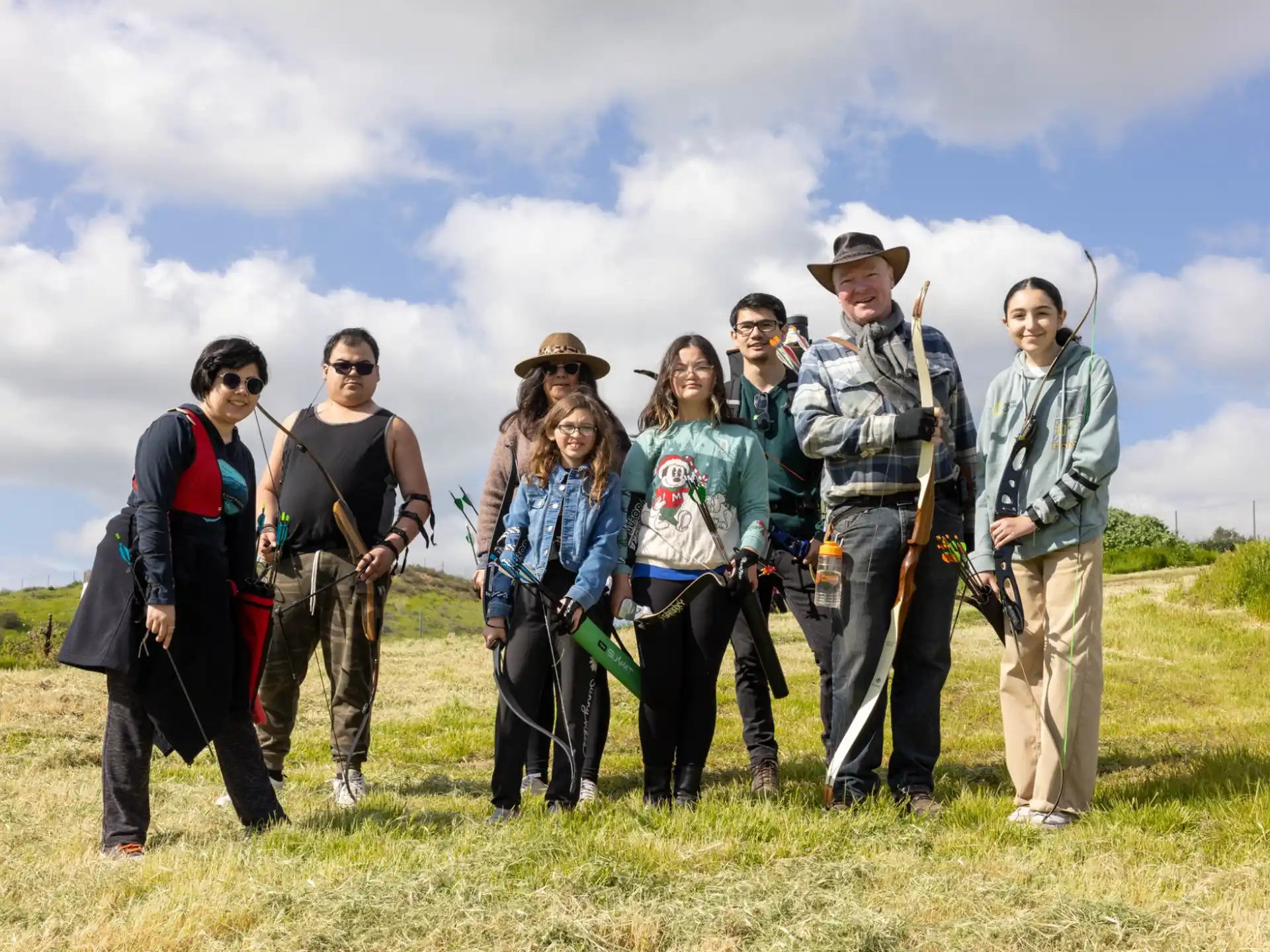 a group of people standing in a field
