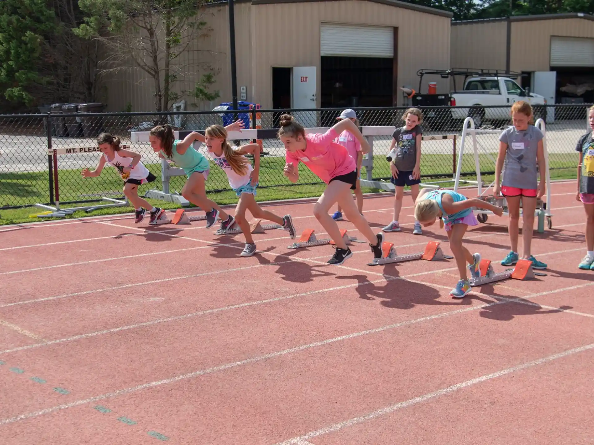 a group of people running on a track