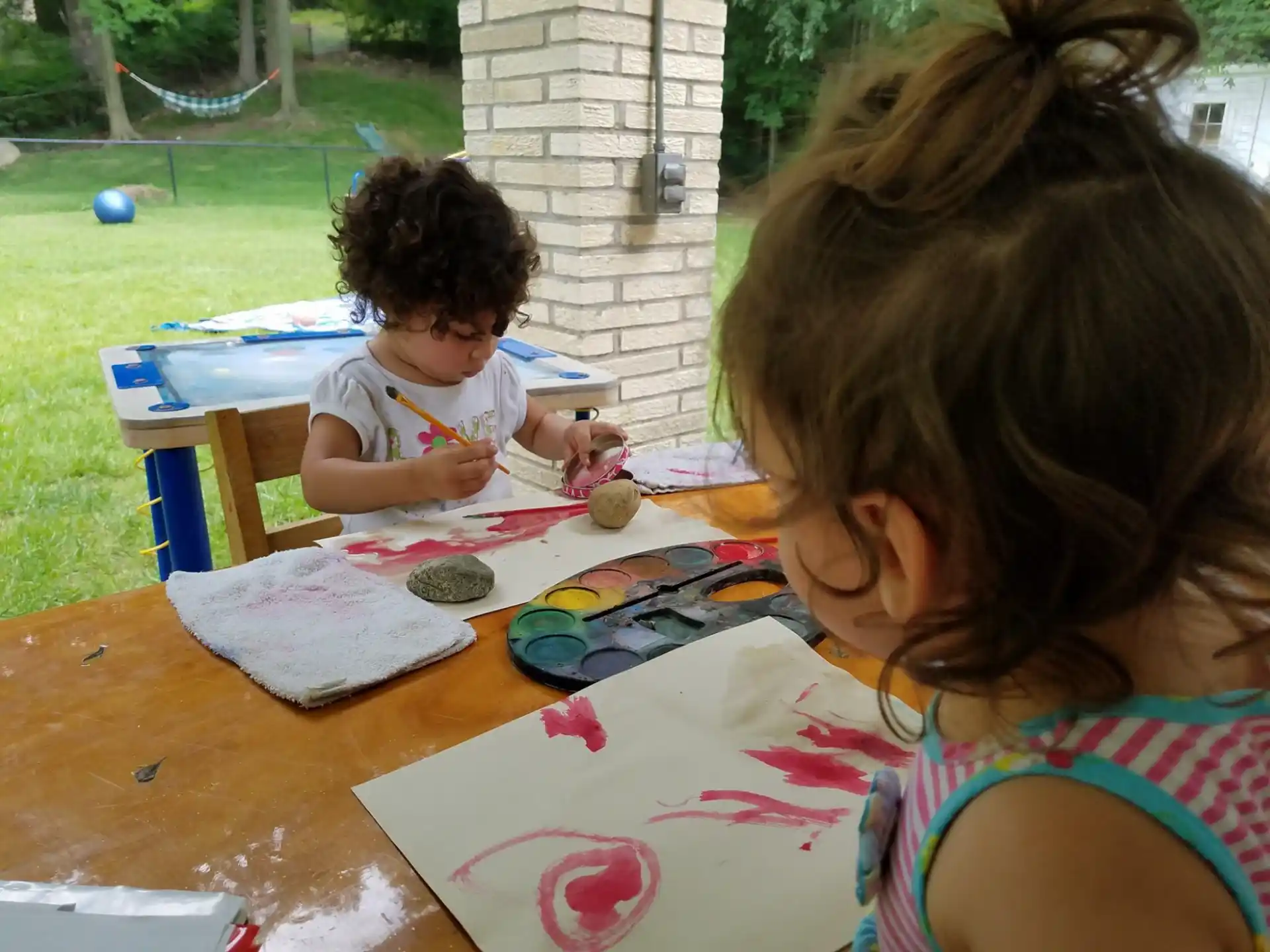 a person and a child painting