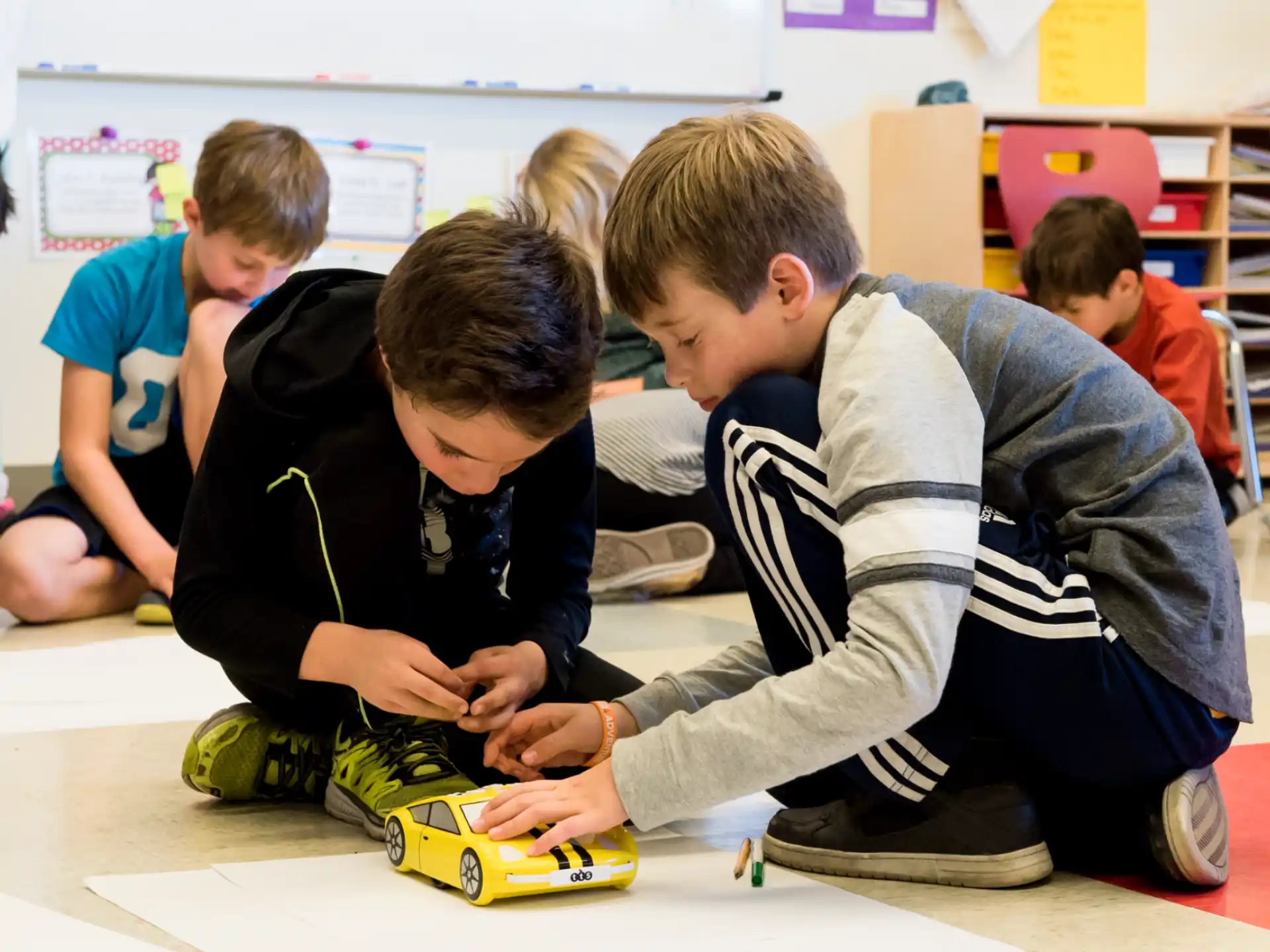 a group of children playing with a toy