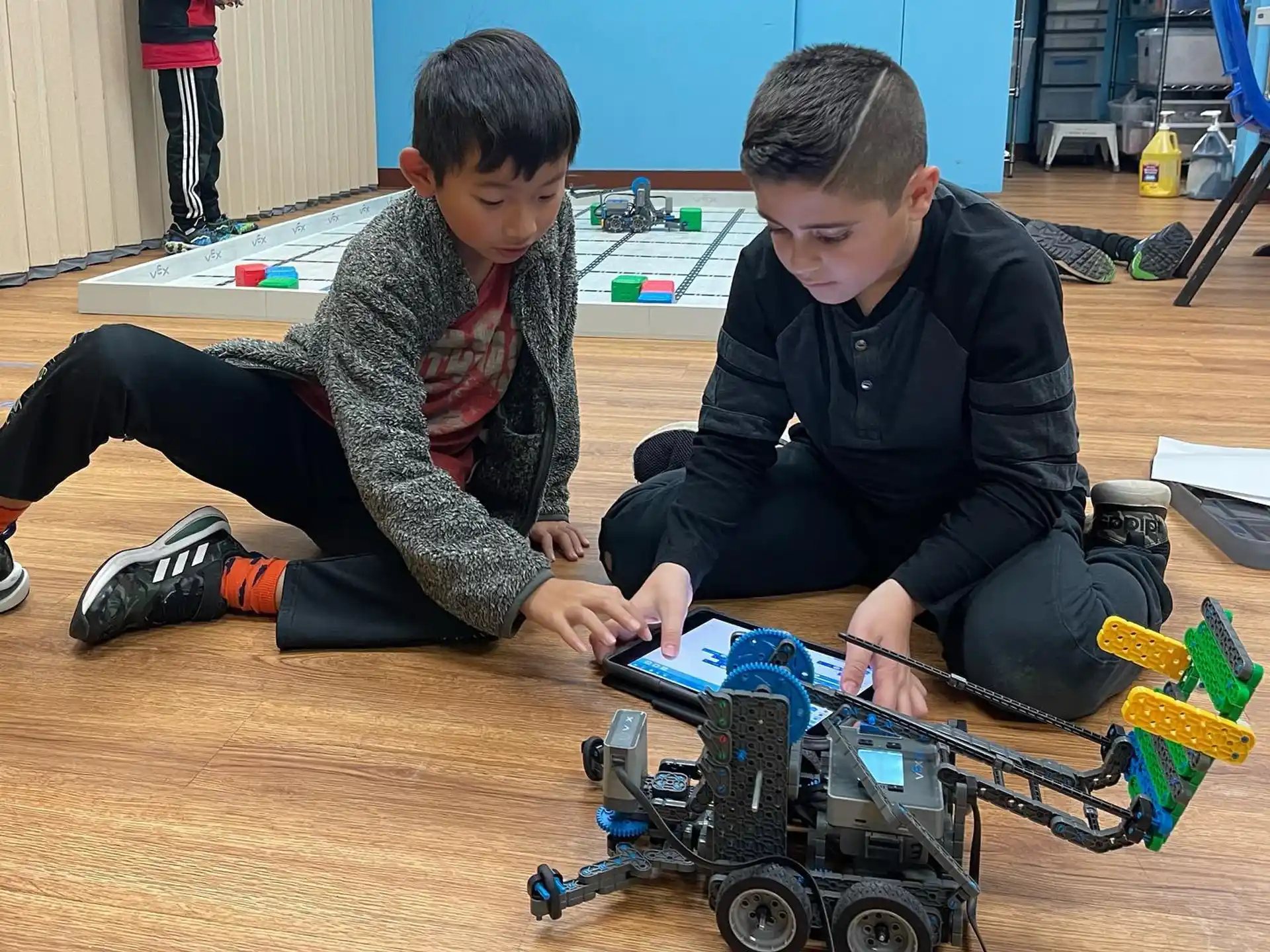 a couple of boys playing with toys