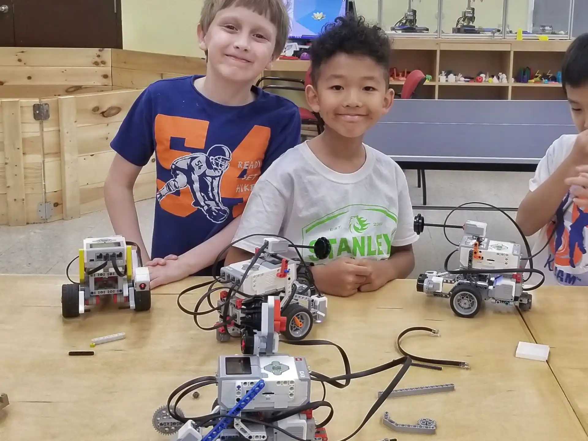 a couple of boys with toy cars