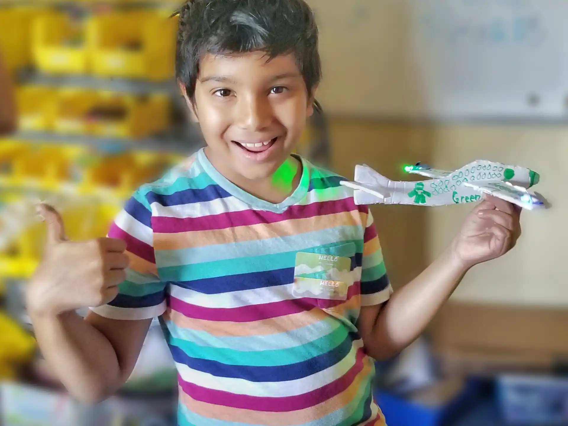 a young boy holding a syringe