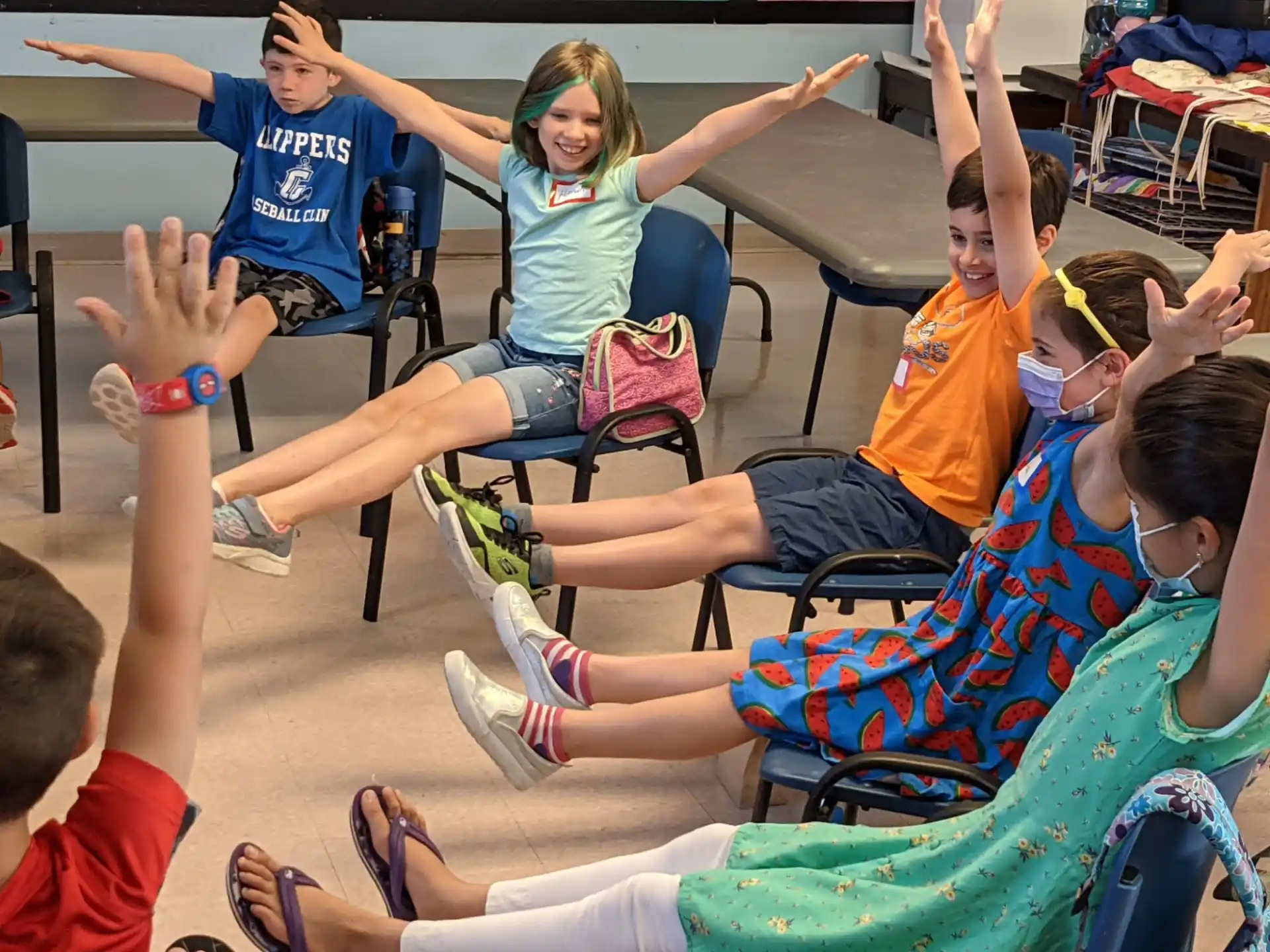 a group of people sitting on chairs