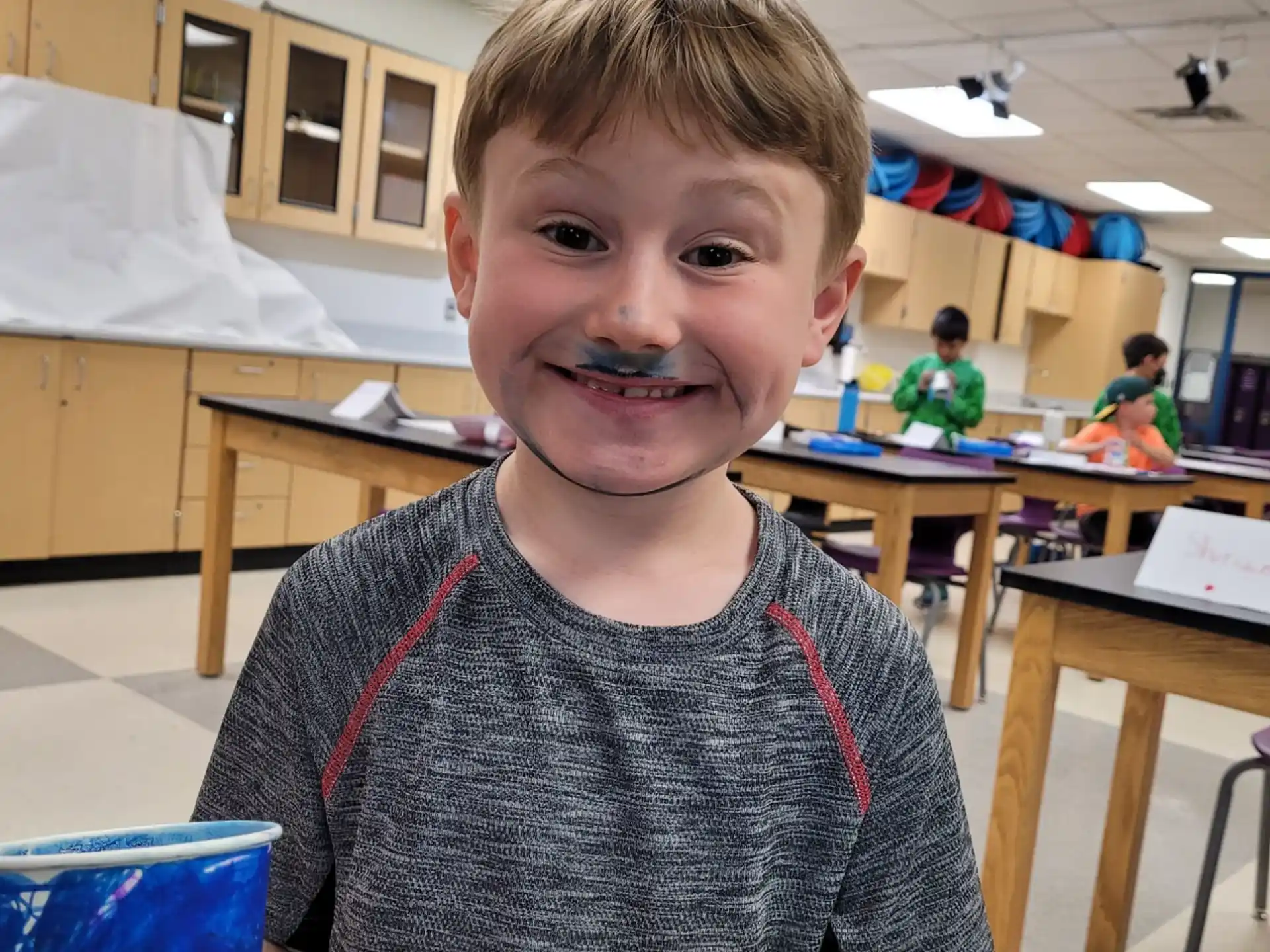 a boy smiling for the camera
