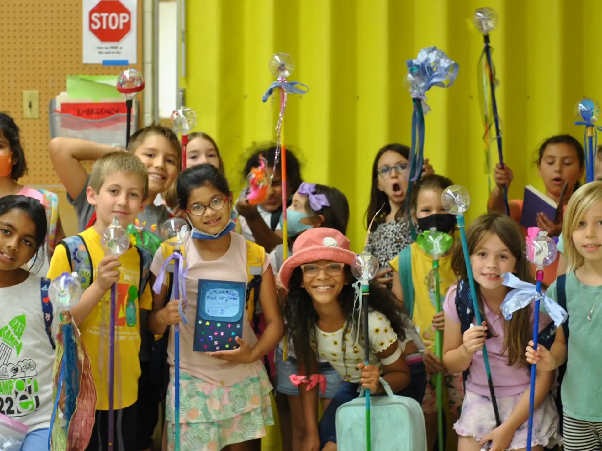 a group of children holding objects