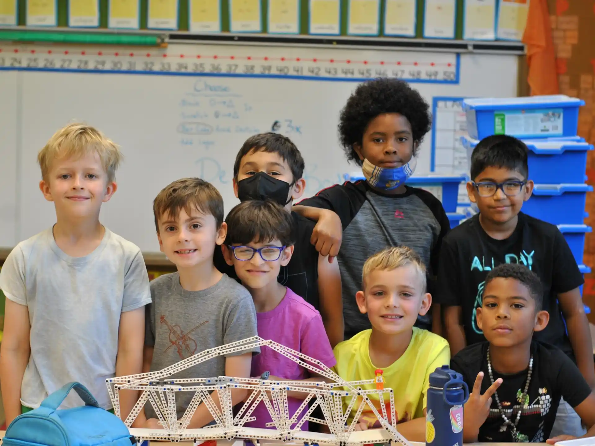 a group of kids posing for a photo