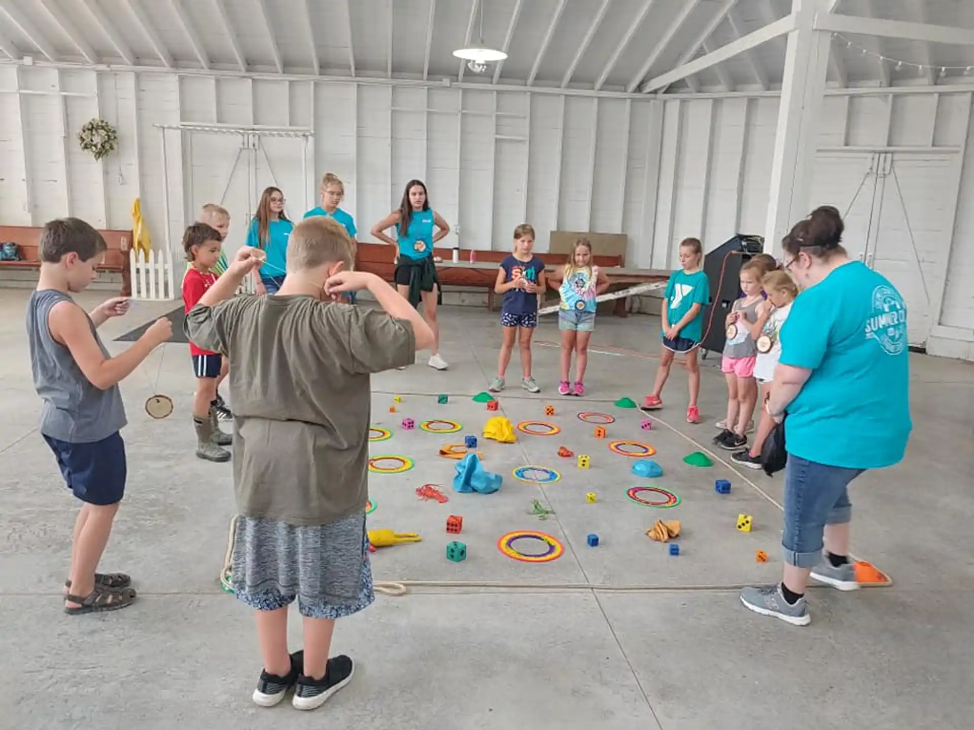 a group of people playing with toys
