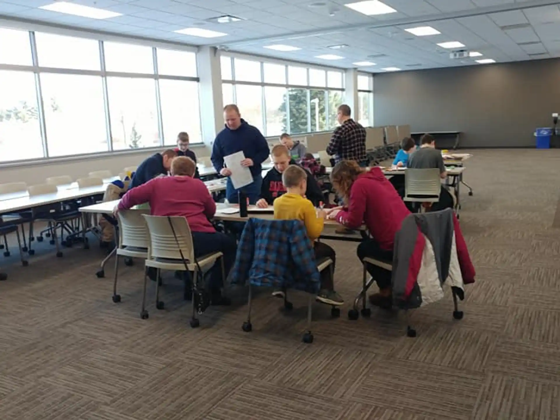 a group of people sitting at tables