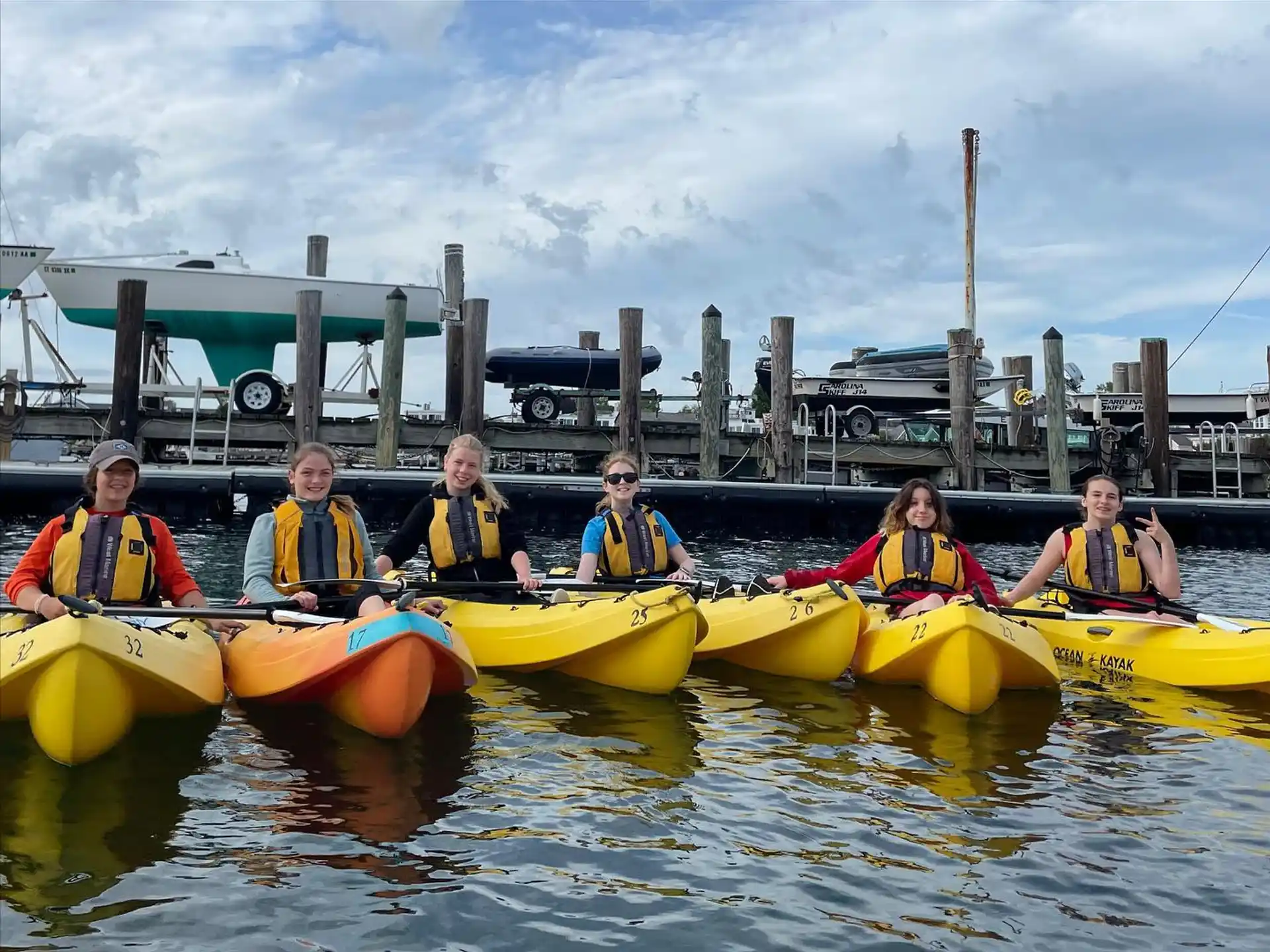 a group of people in canoes