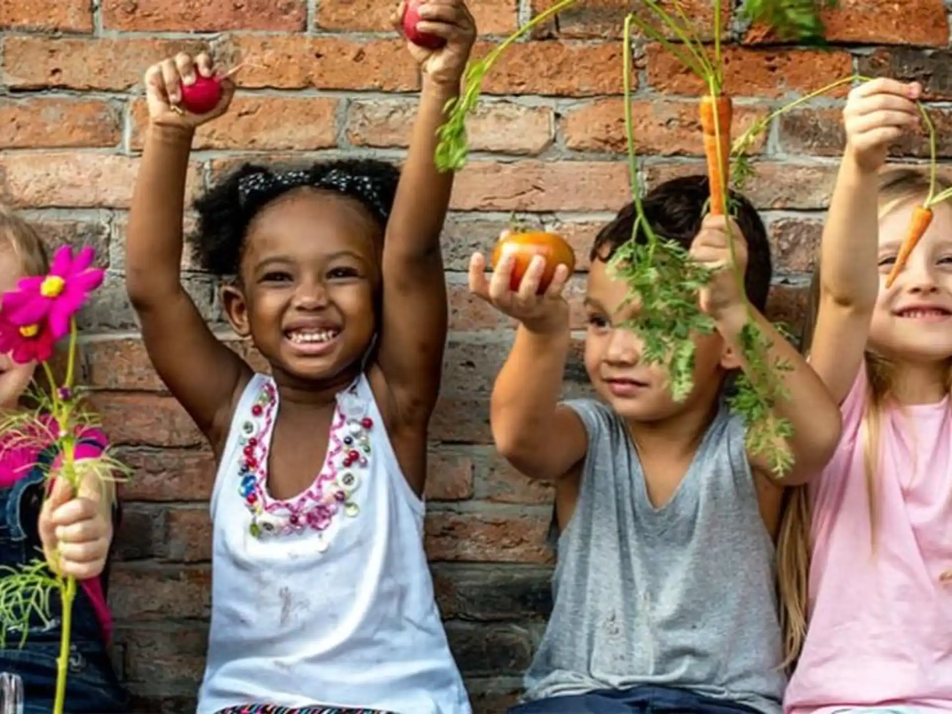 a group of children holding flowers
