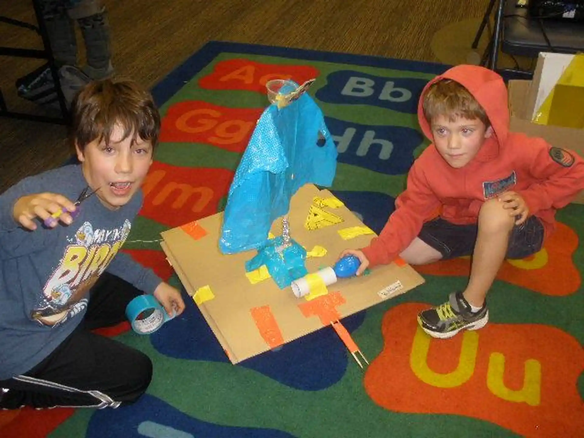 a couple of boys playing with toys