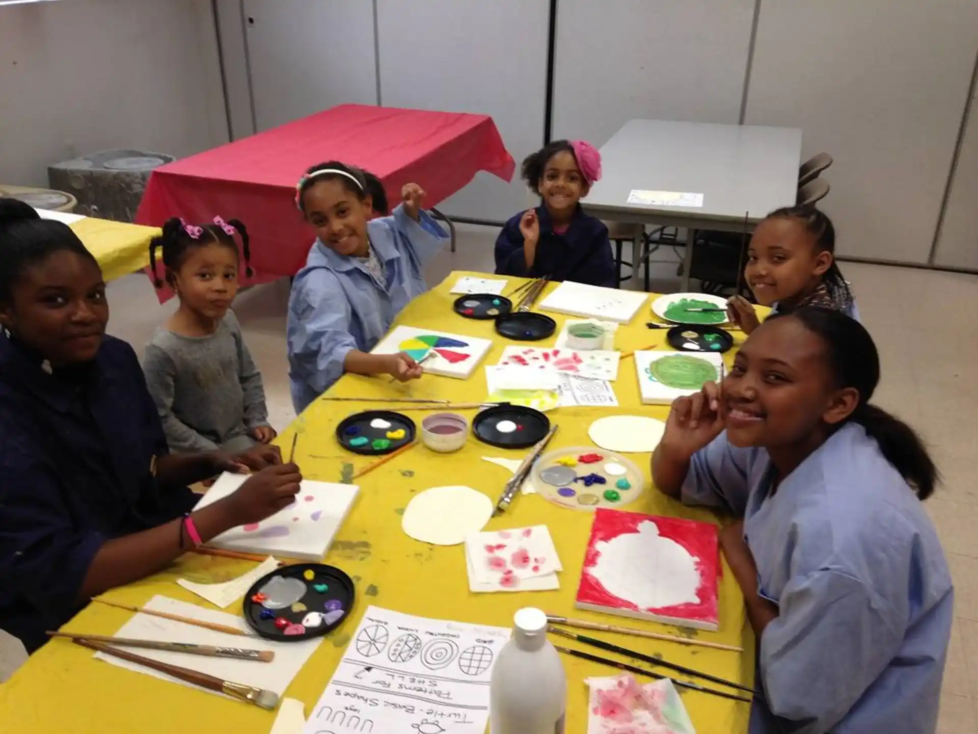 a group of children sitting at a table