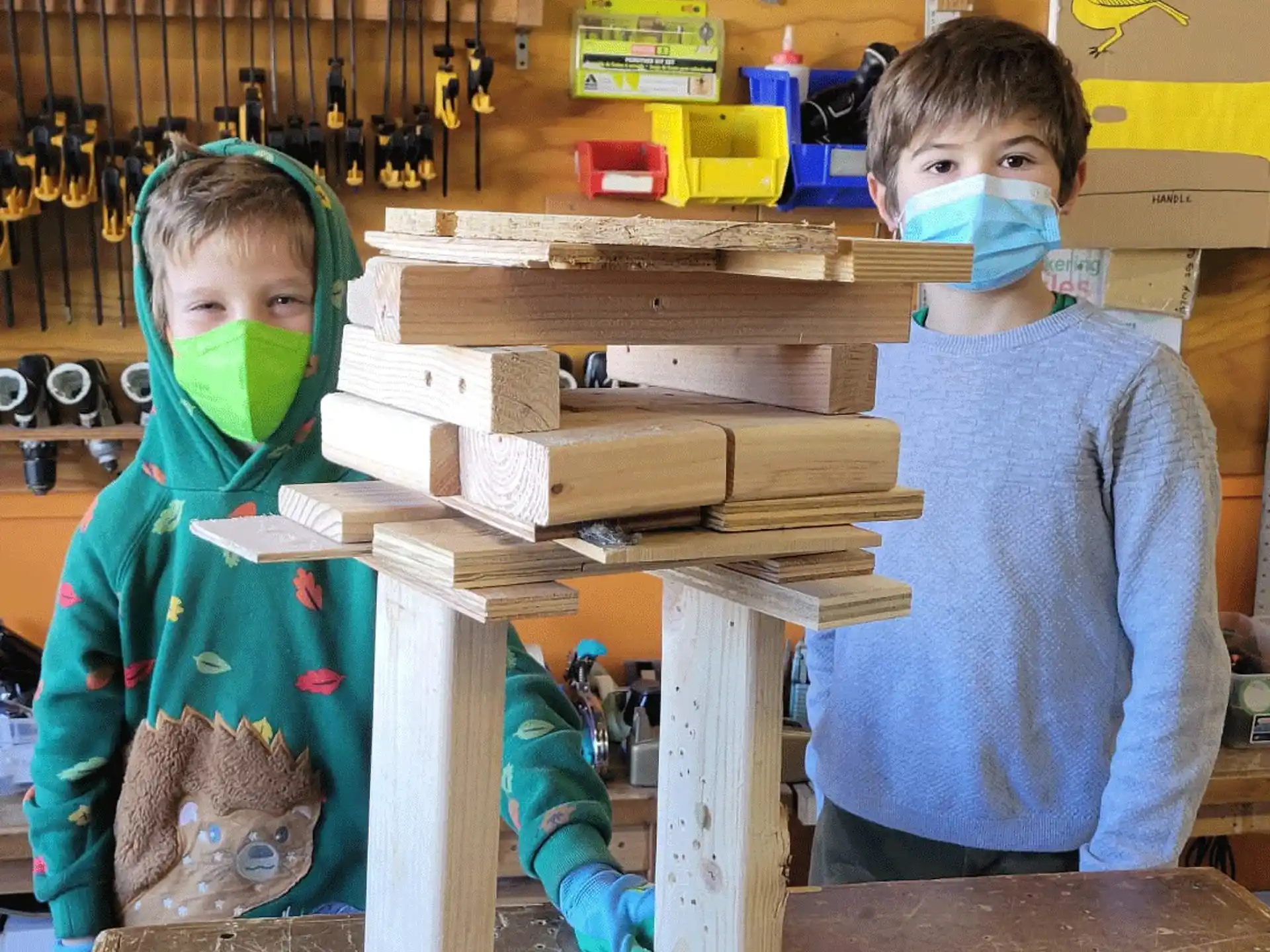 a couple of children wearing masks