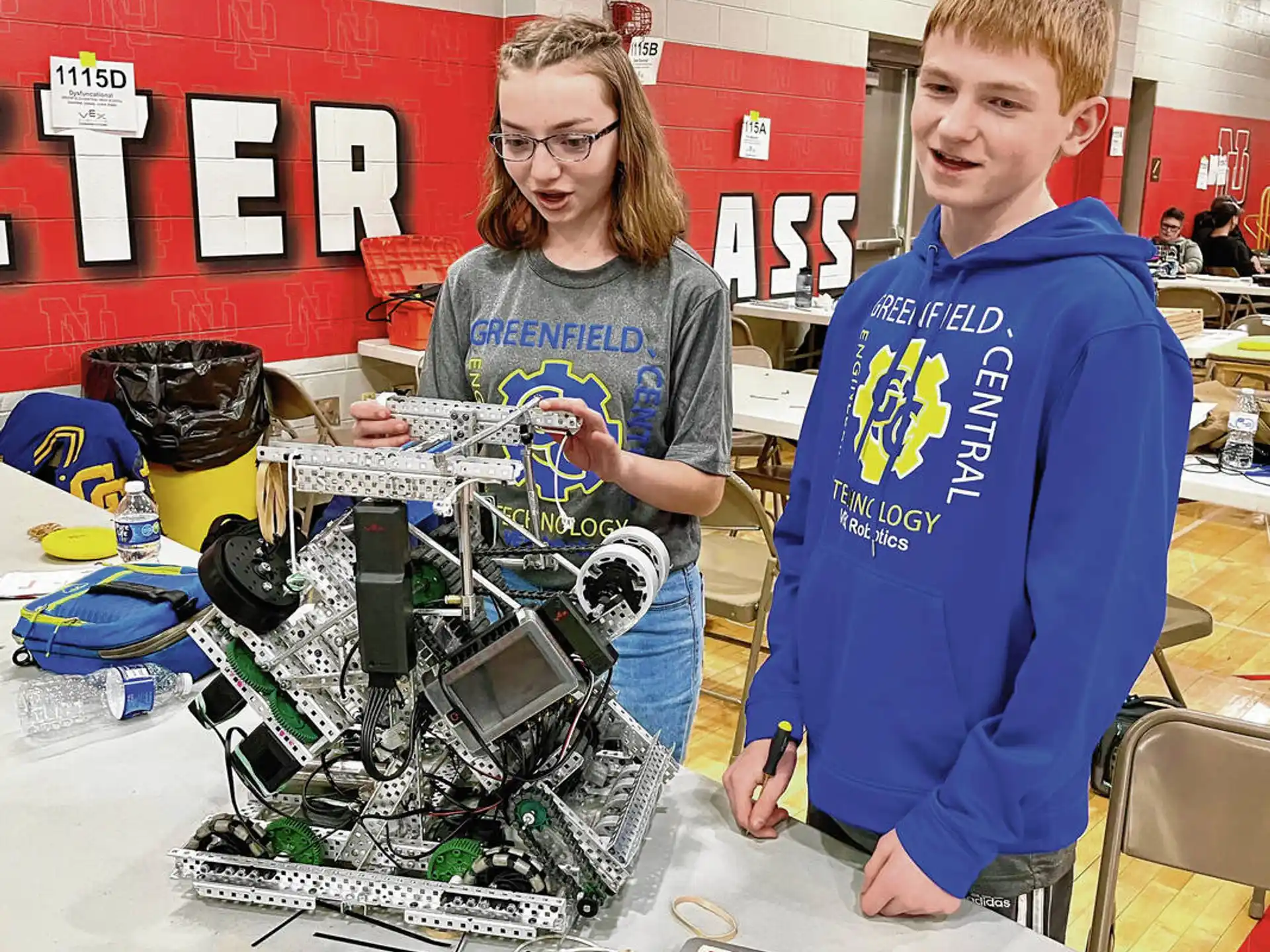 a person and a boy with a robot