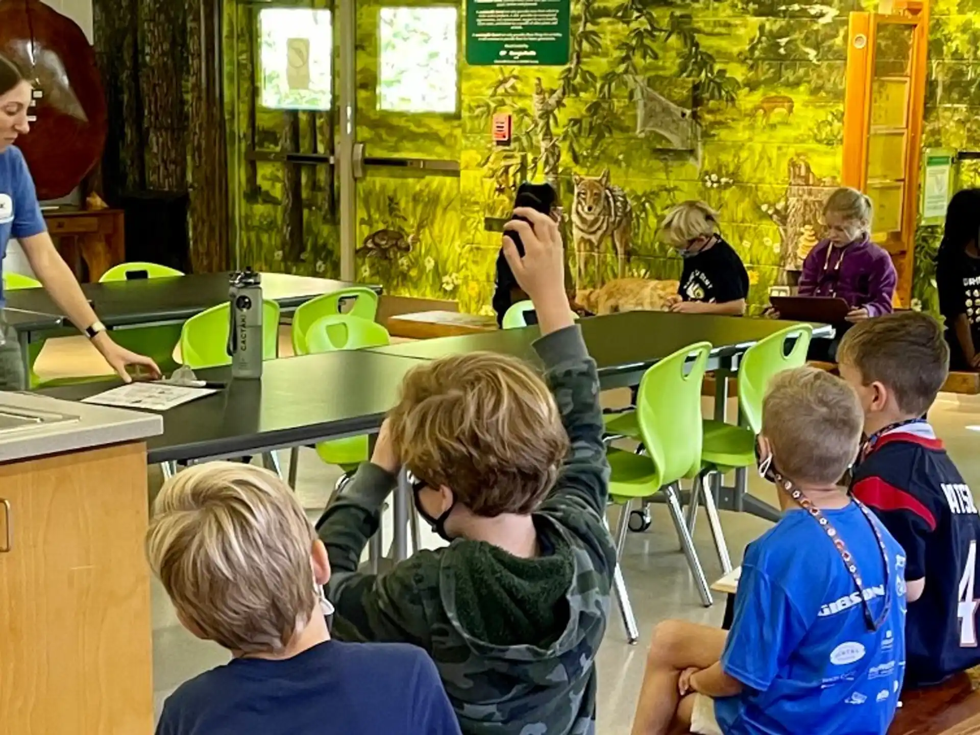 a person teaching children in a classroom