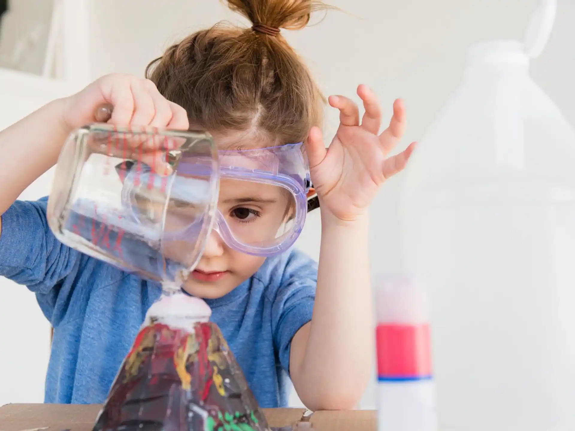 a young girl with a plastic bag over her face