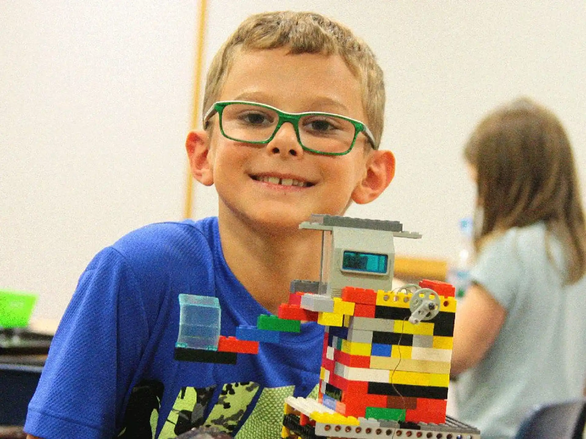 a boy wearing glasses