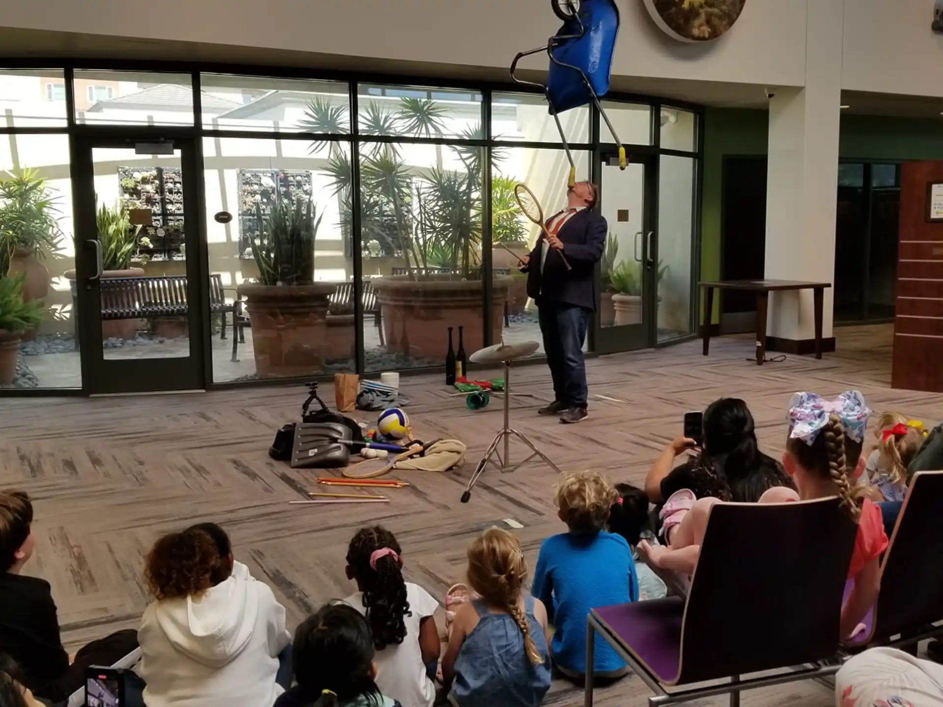 a person playing a guitar in front of a group of people
