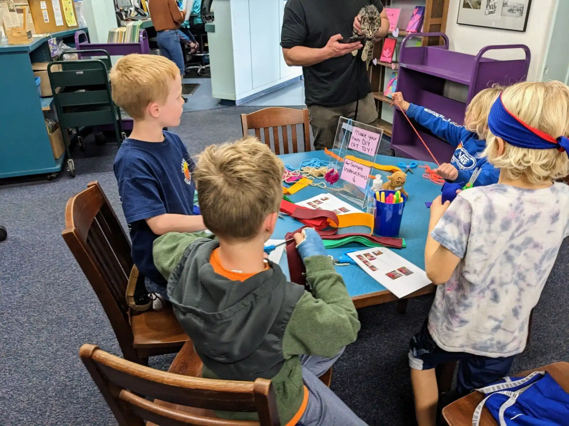 a group of children sitting at a table