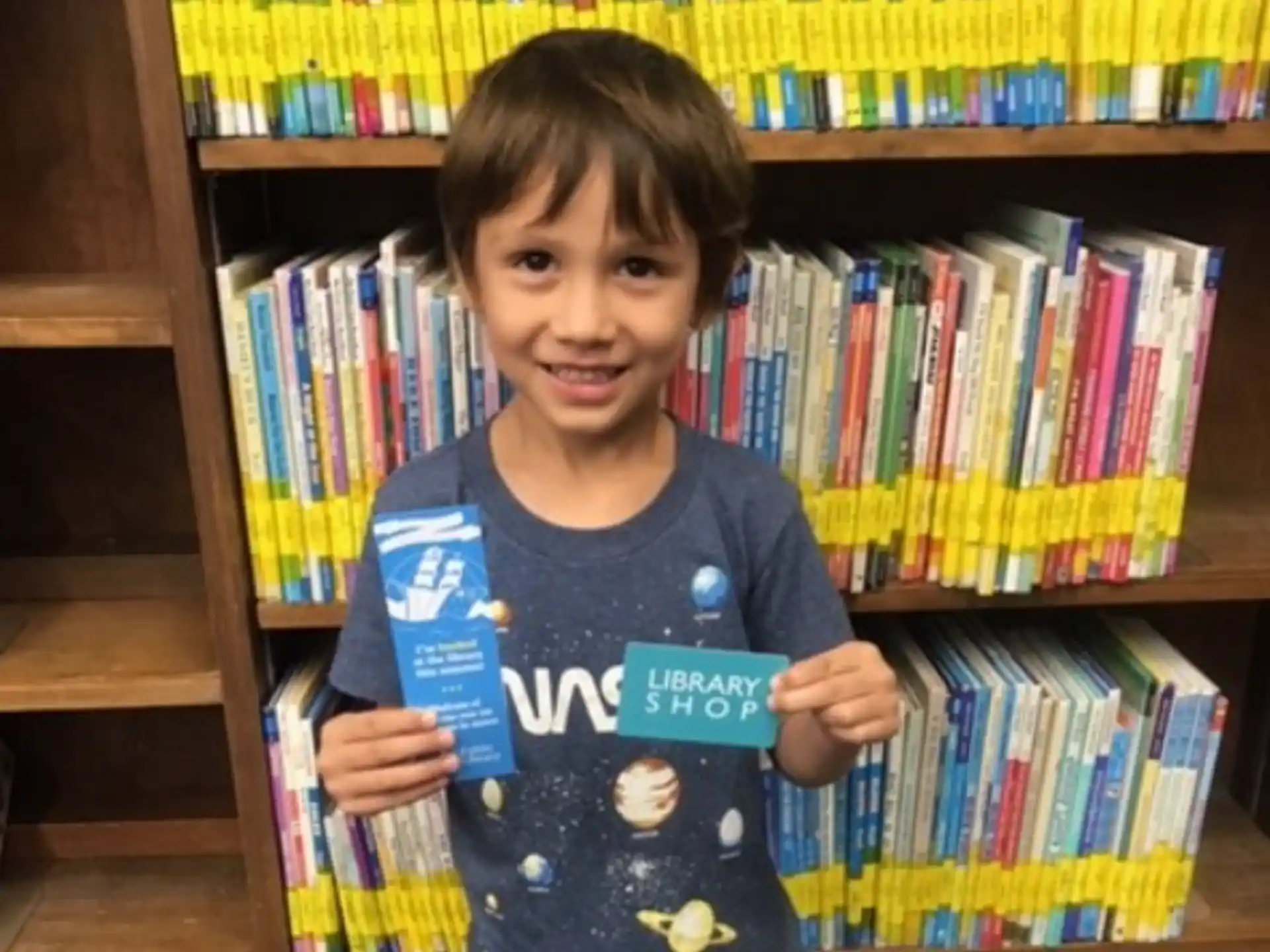 a boy holding a book