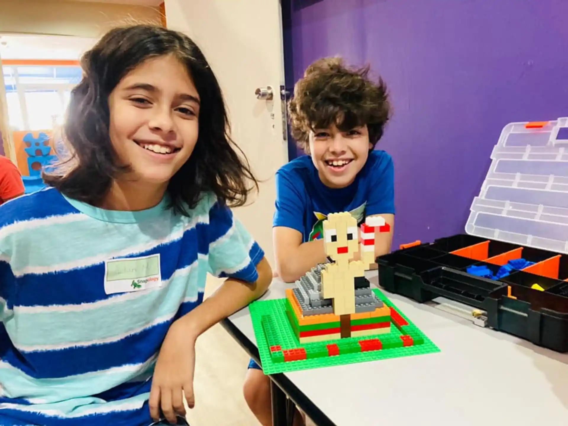 a person and a boy smiling