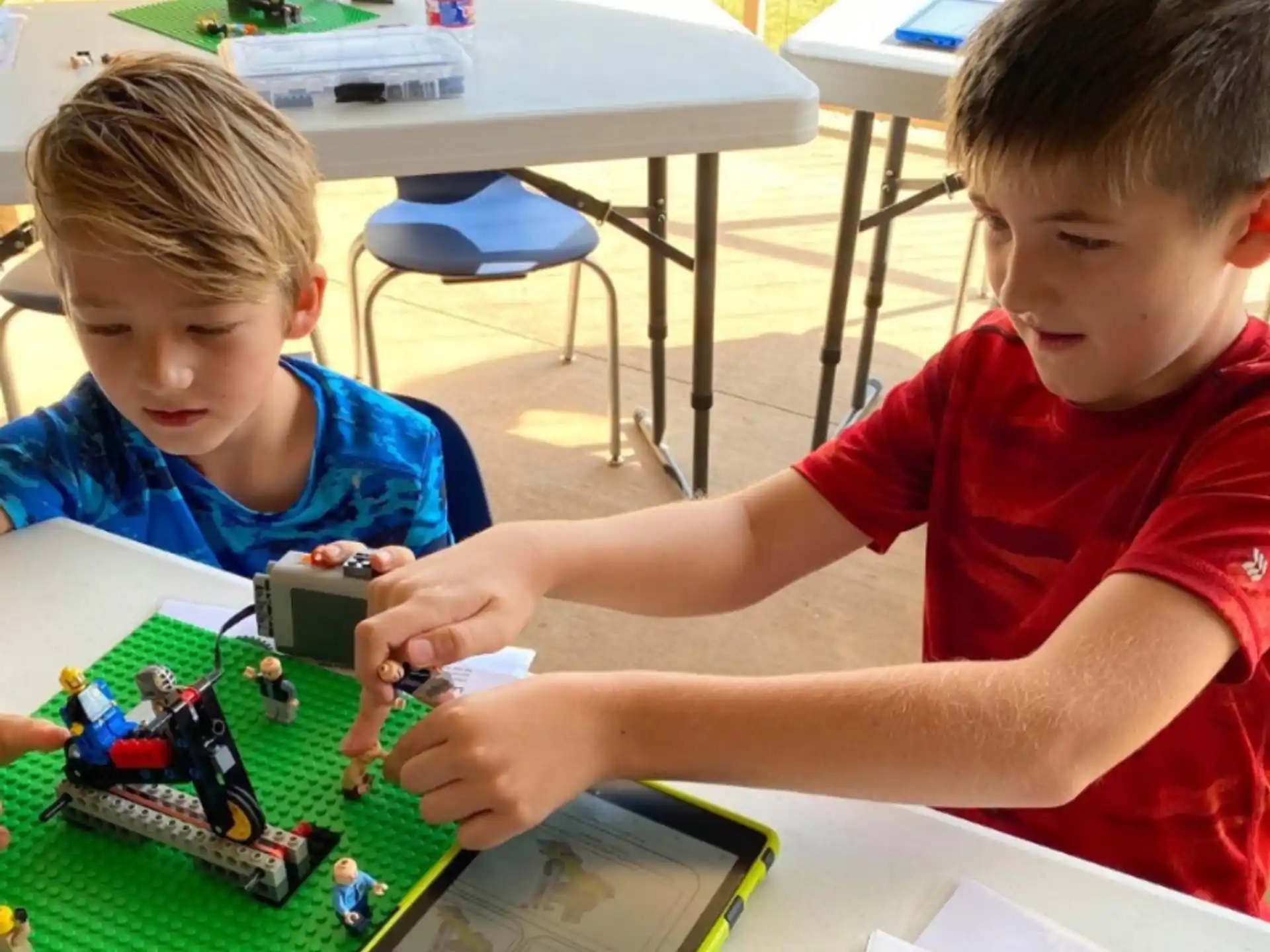 a couple of boys playing with toys