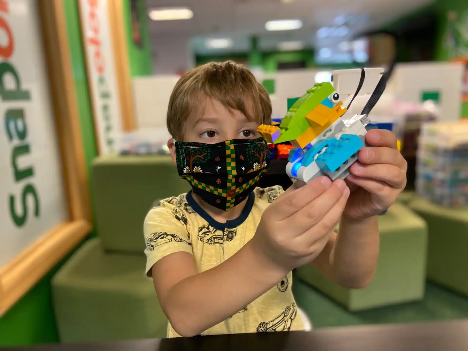 a boy holding a toy gun