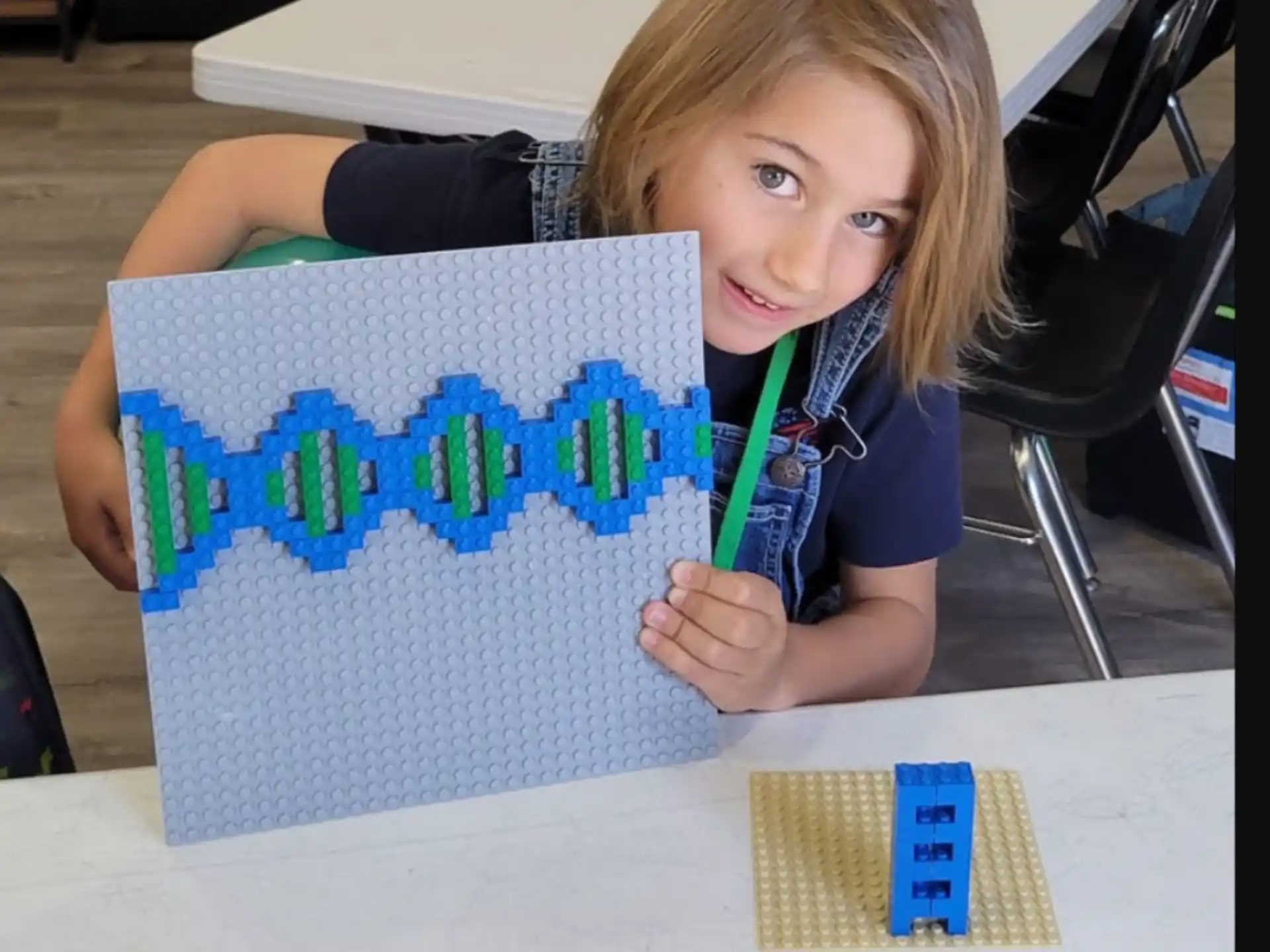 a child holding a sign
