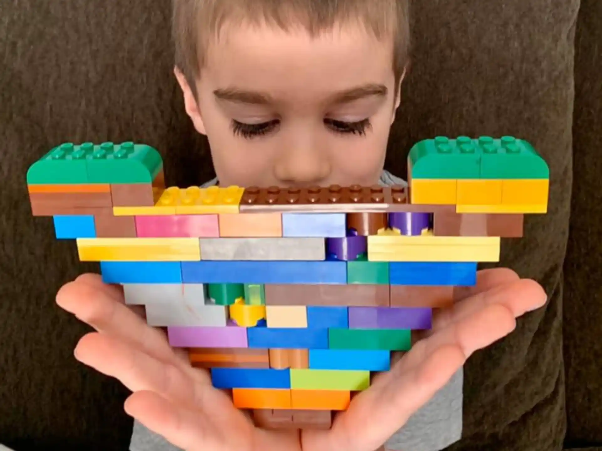 a boy holding a toy