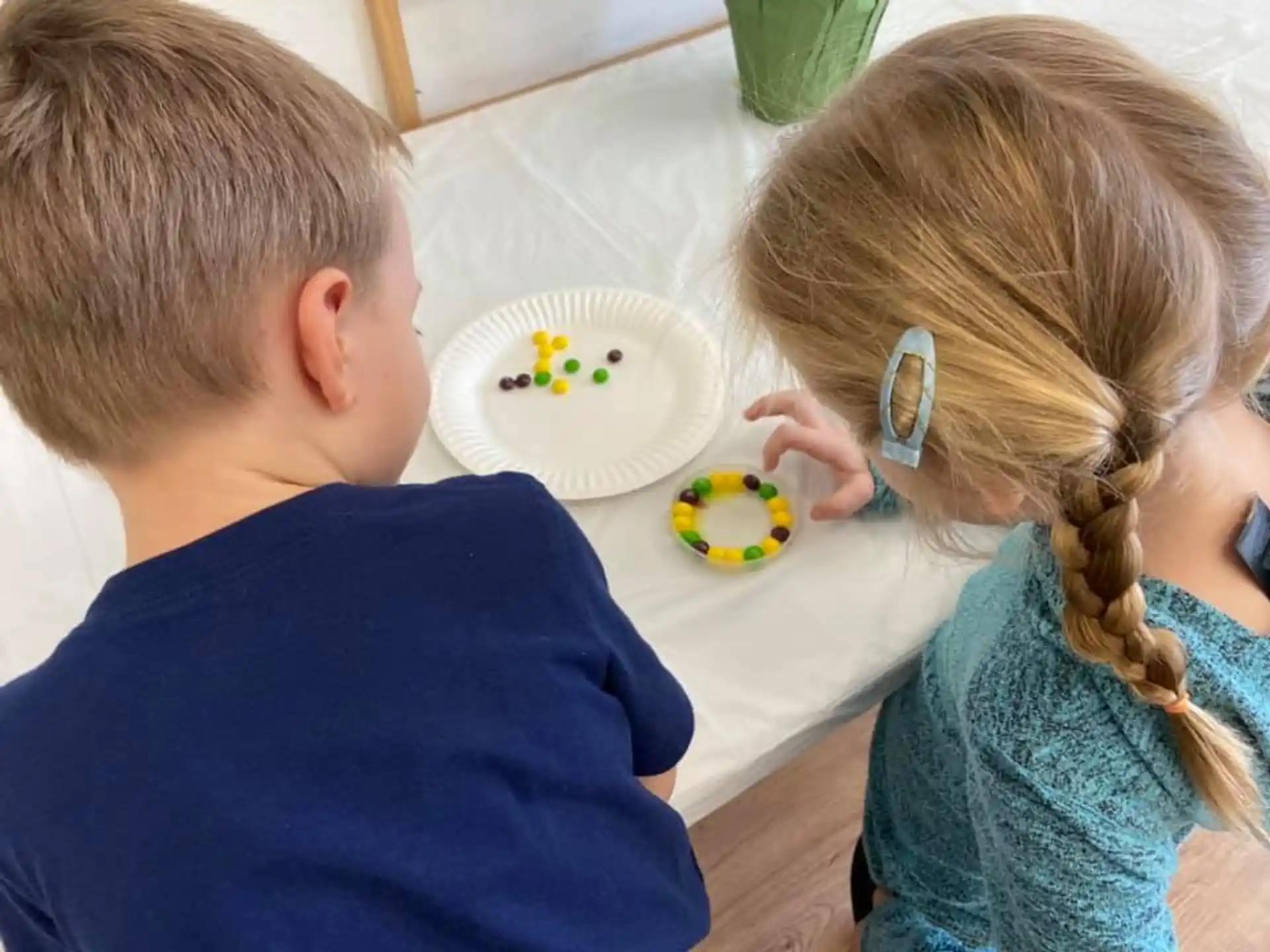 a boy and girl eating cake