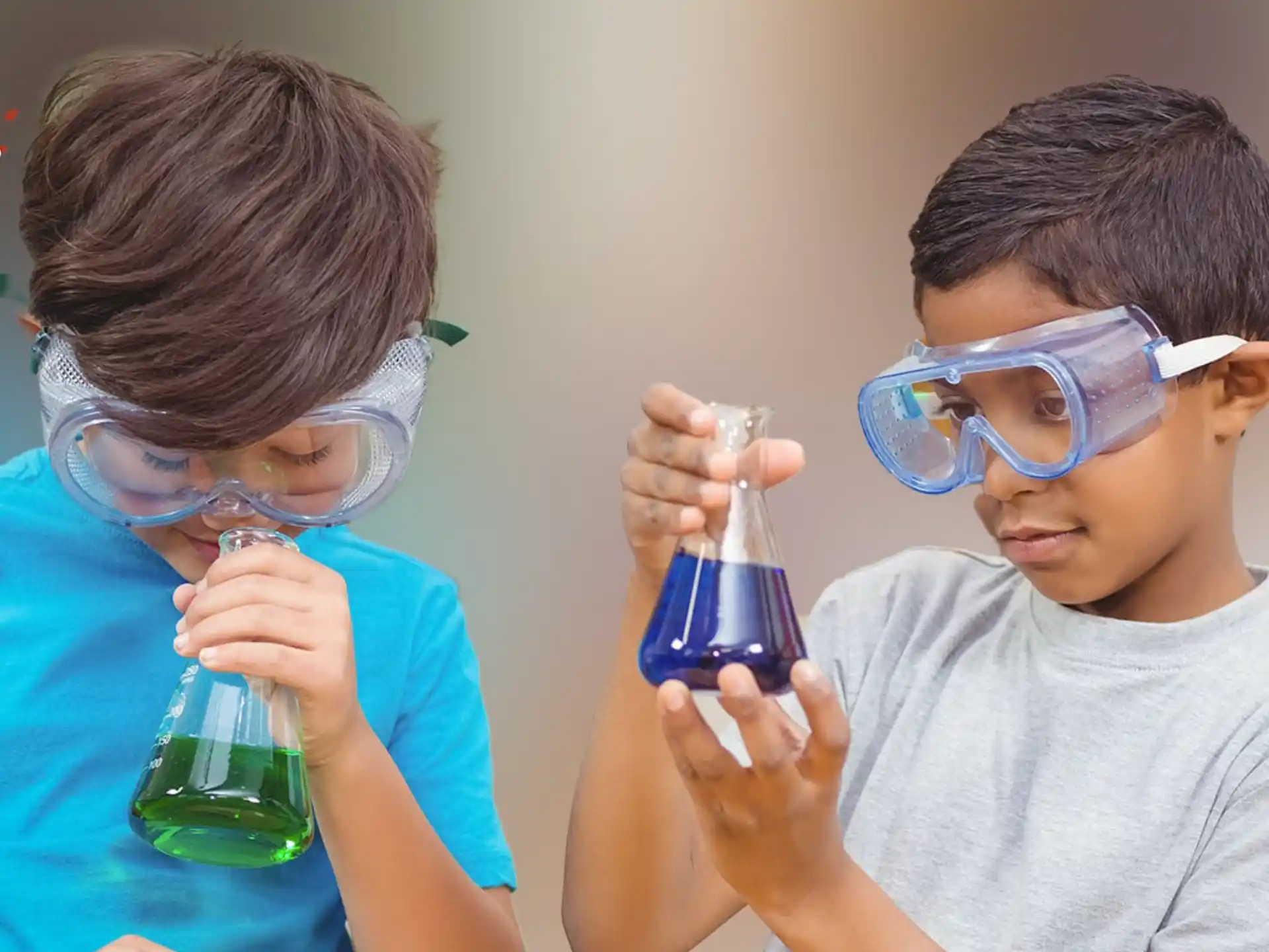 a couple of young boys wearing goggles and looking at a microscope