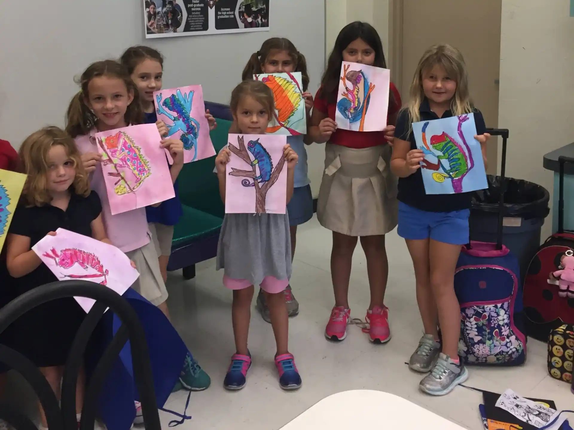 a group of children holding up signs