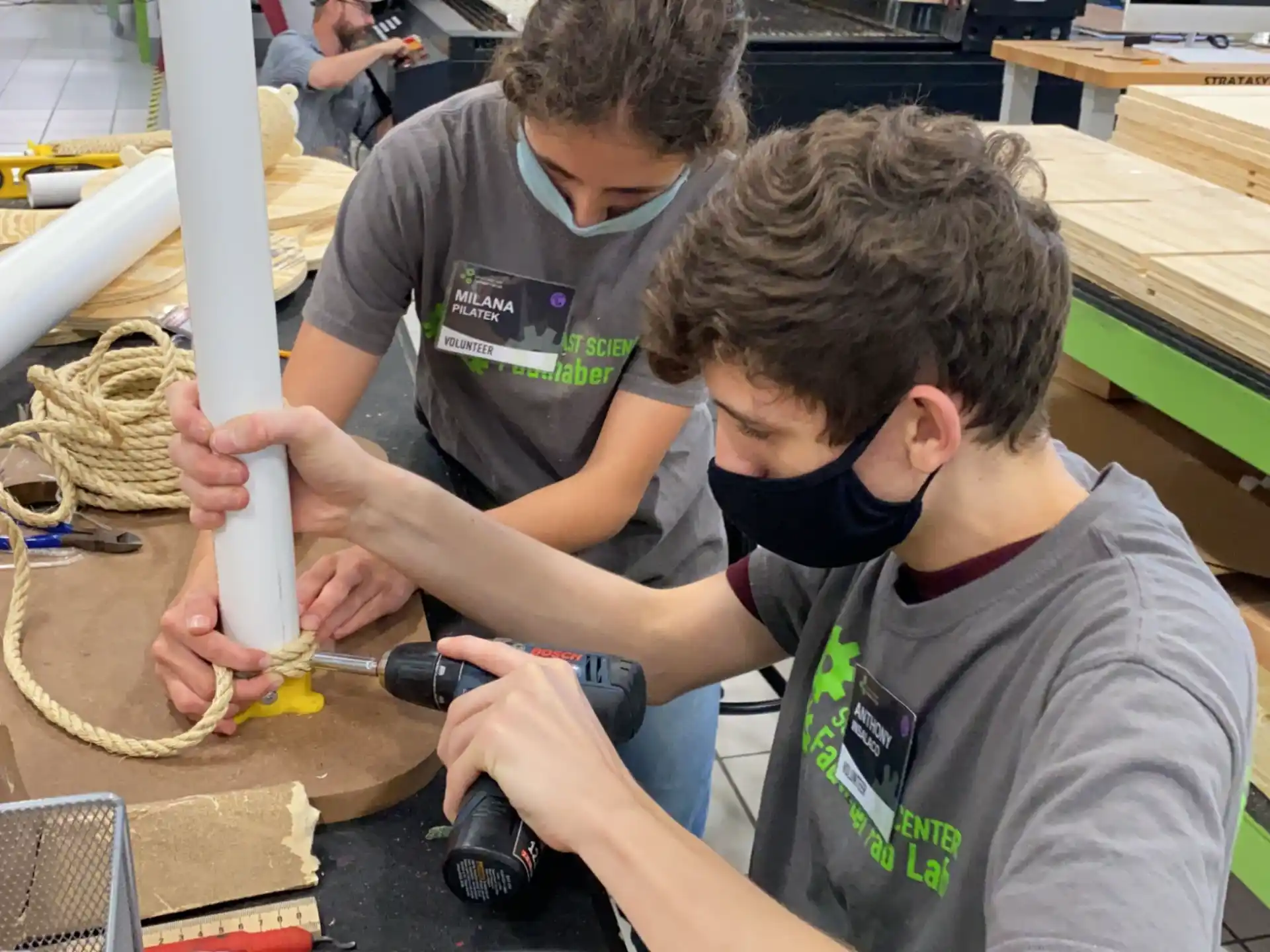 a couple of men working on a project