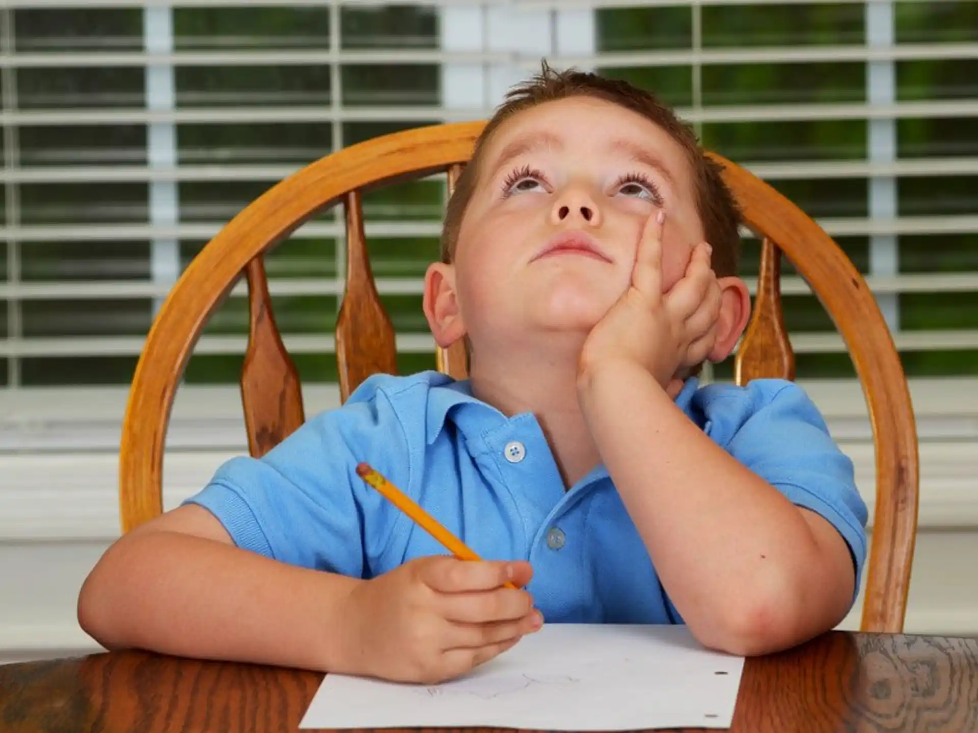 a child with his hands on his face