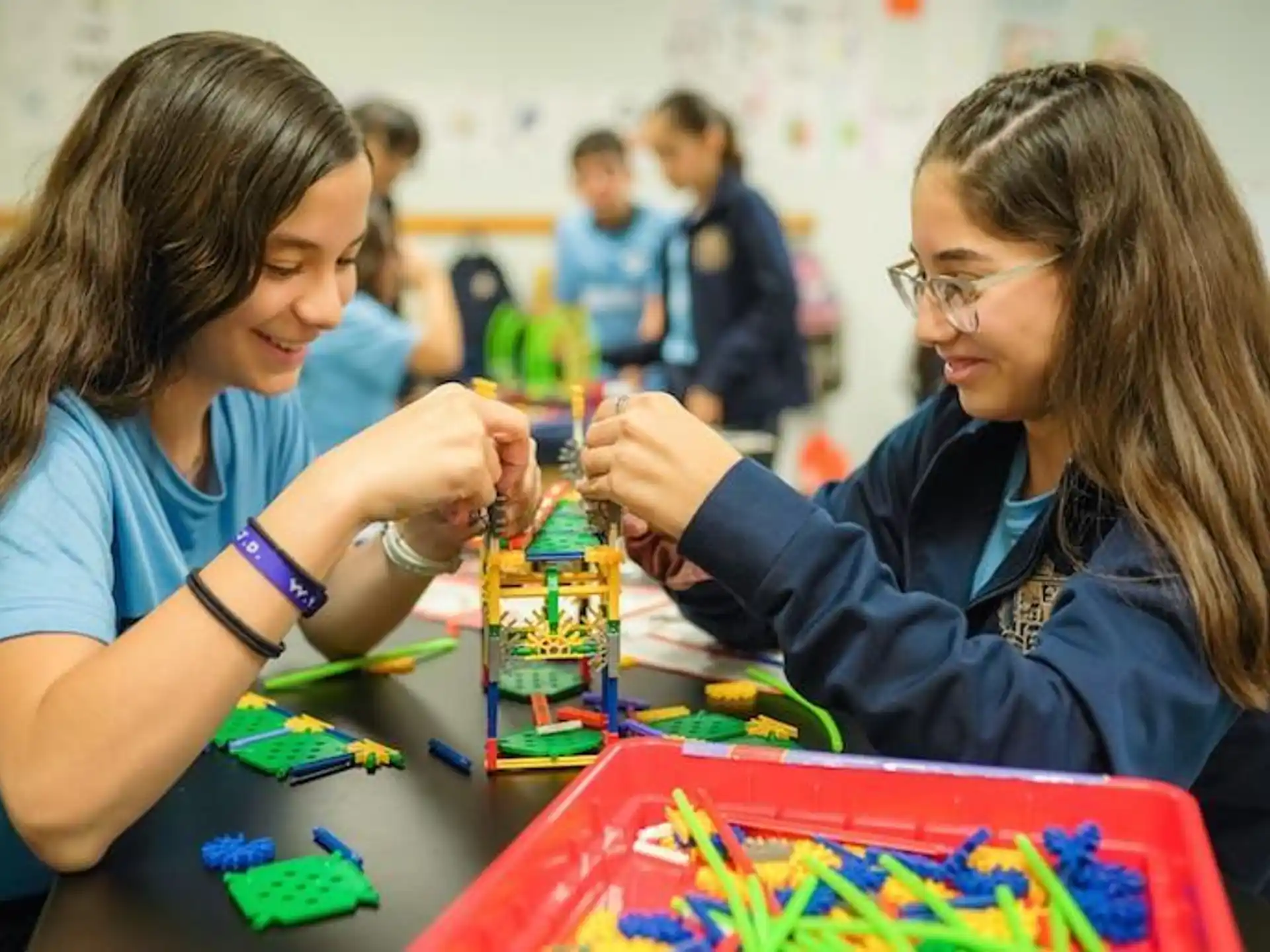 a few young girls playing with toys