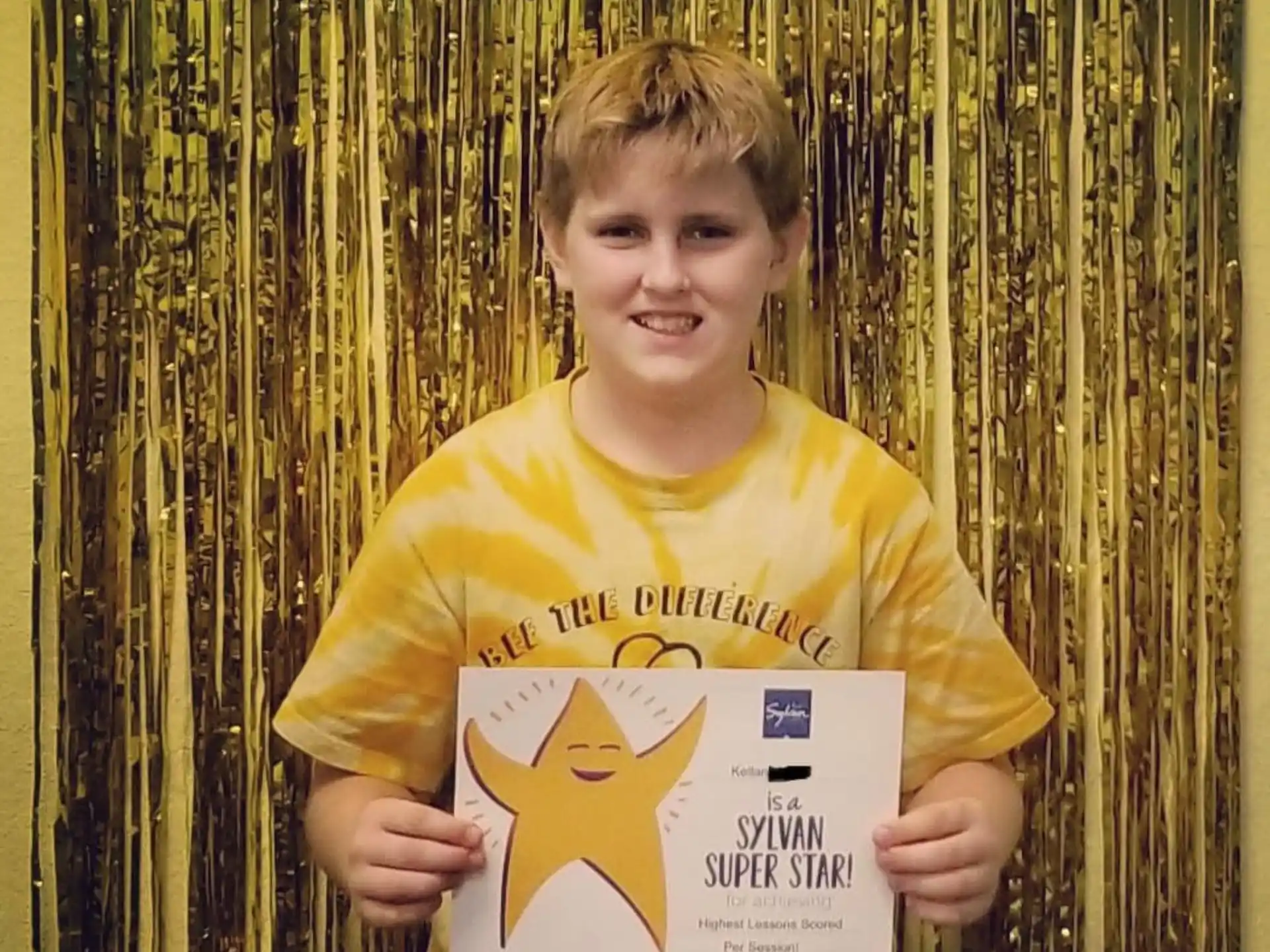 a boy holding a sign