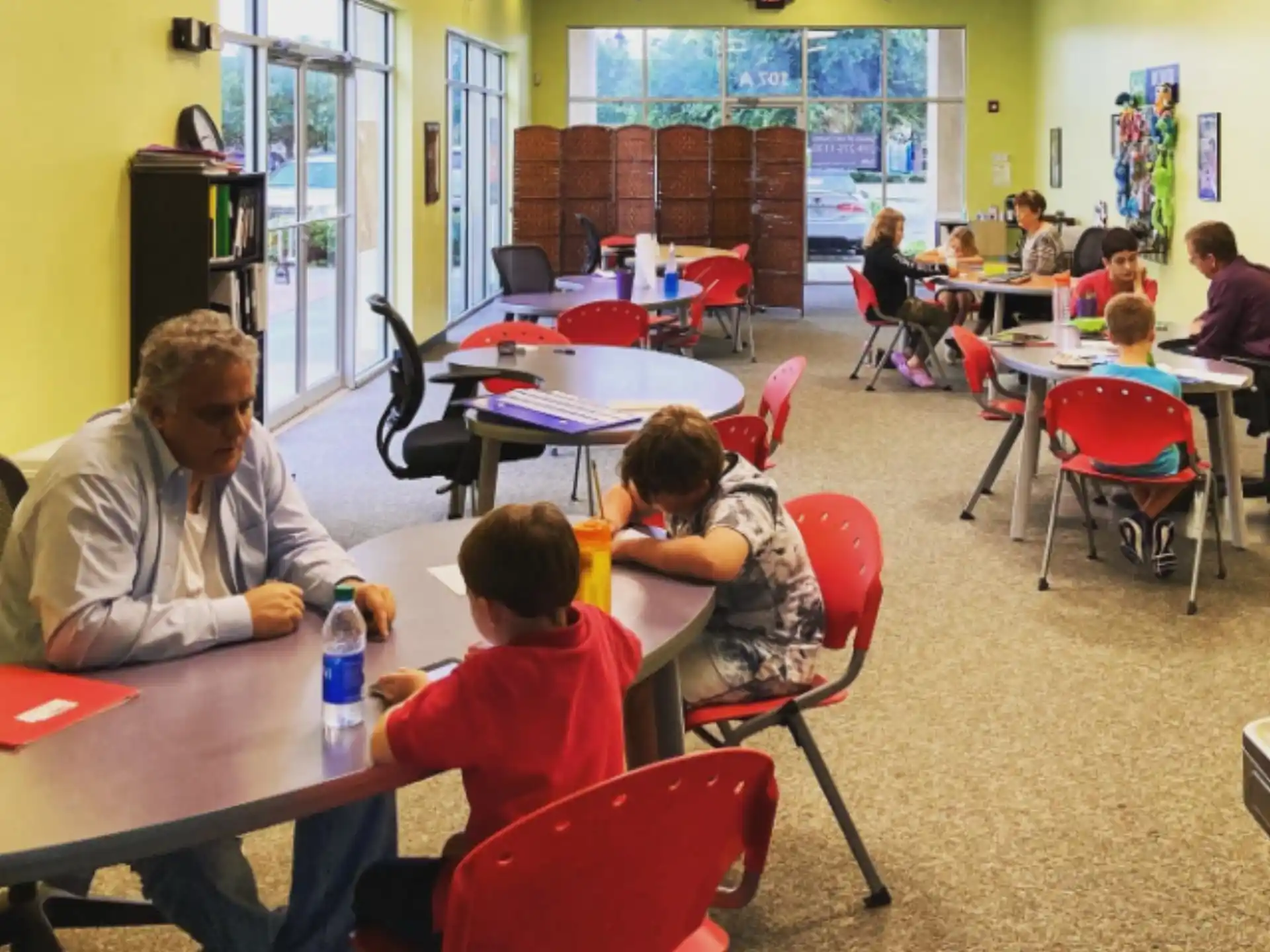 a group of people sitting at tables