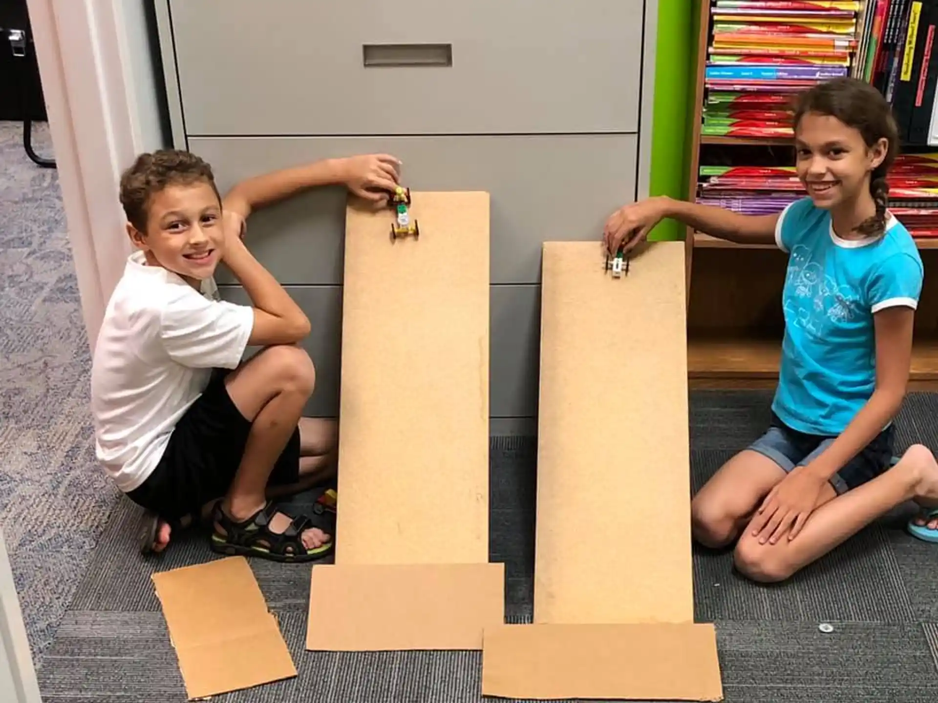 a couple of kids playing with wooden blocks
