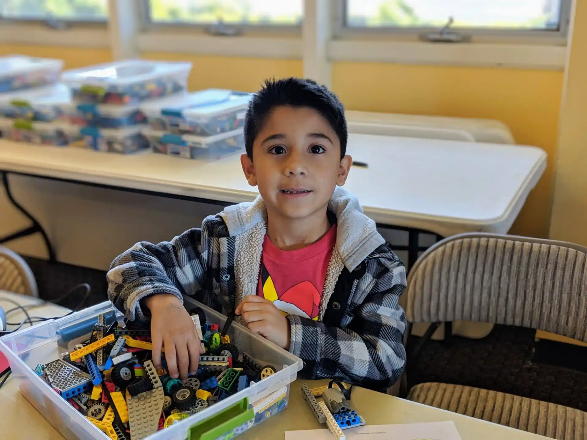 a boy sitting at a table