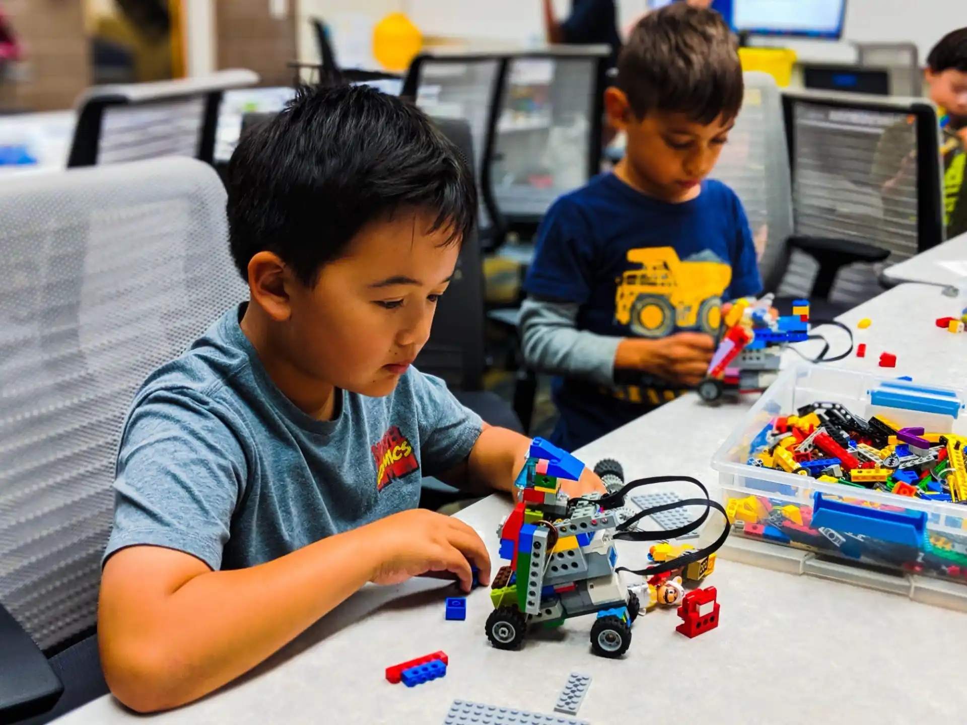 a couple of boys playing with toys