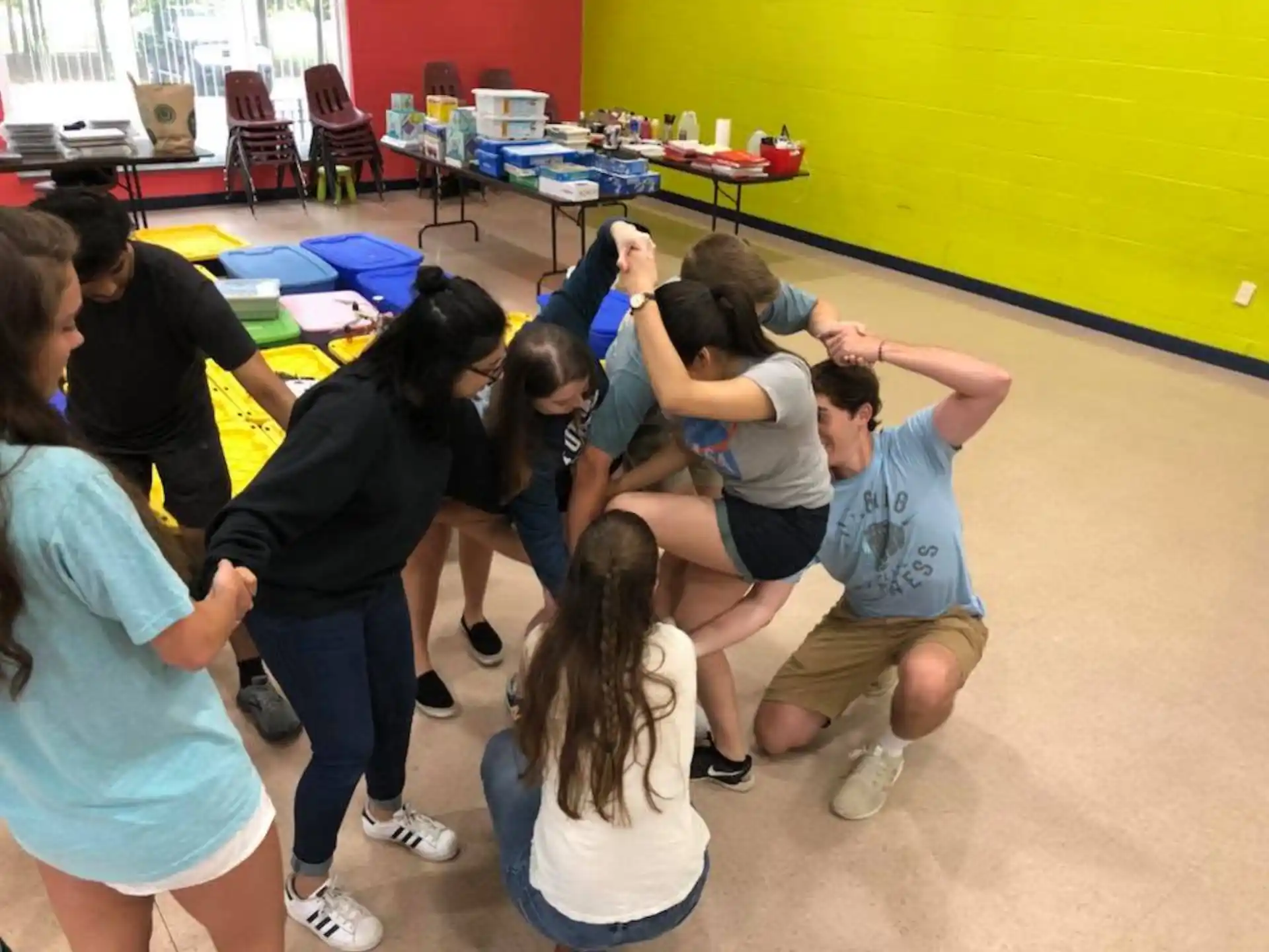 a group of people kneeling on the floor