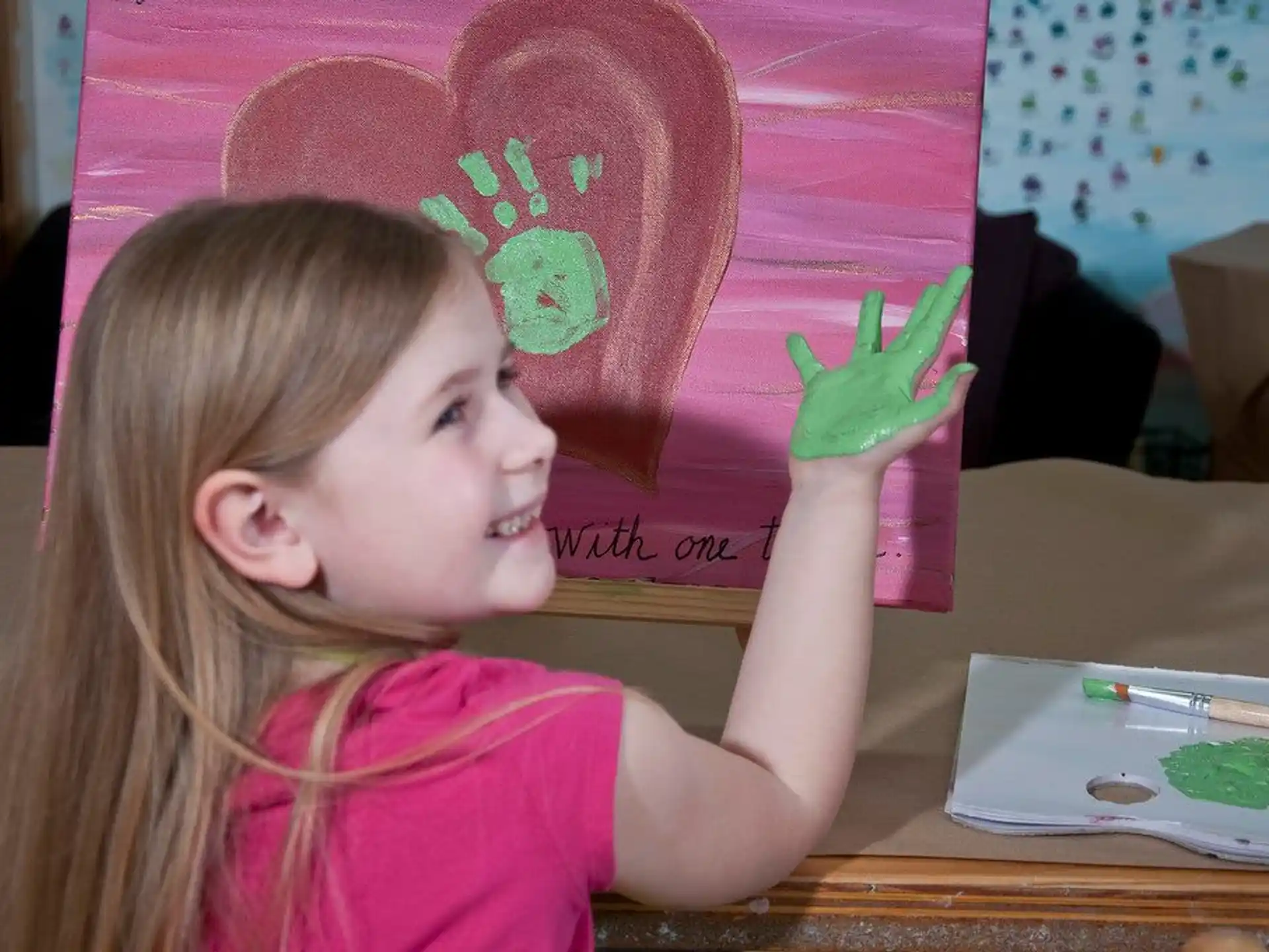 a girl wearing a pink hat