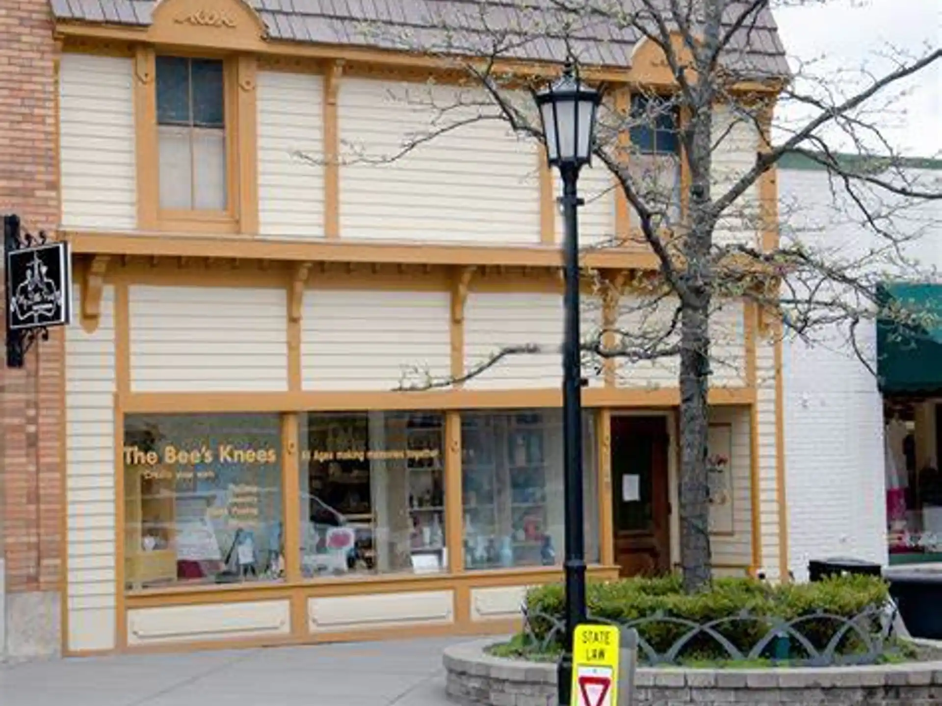 a store front with a lamp post