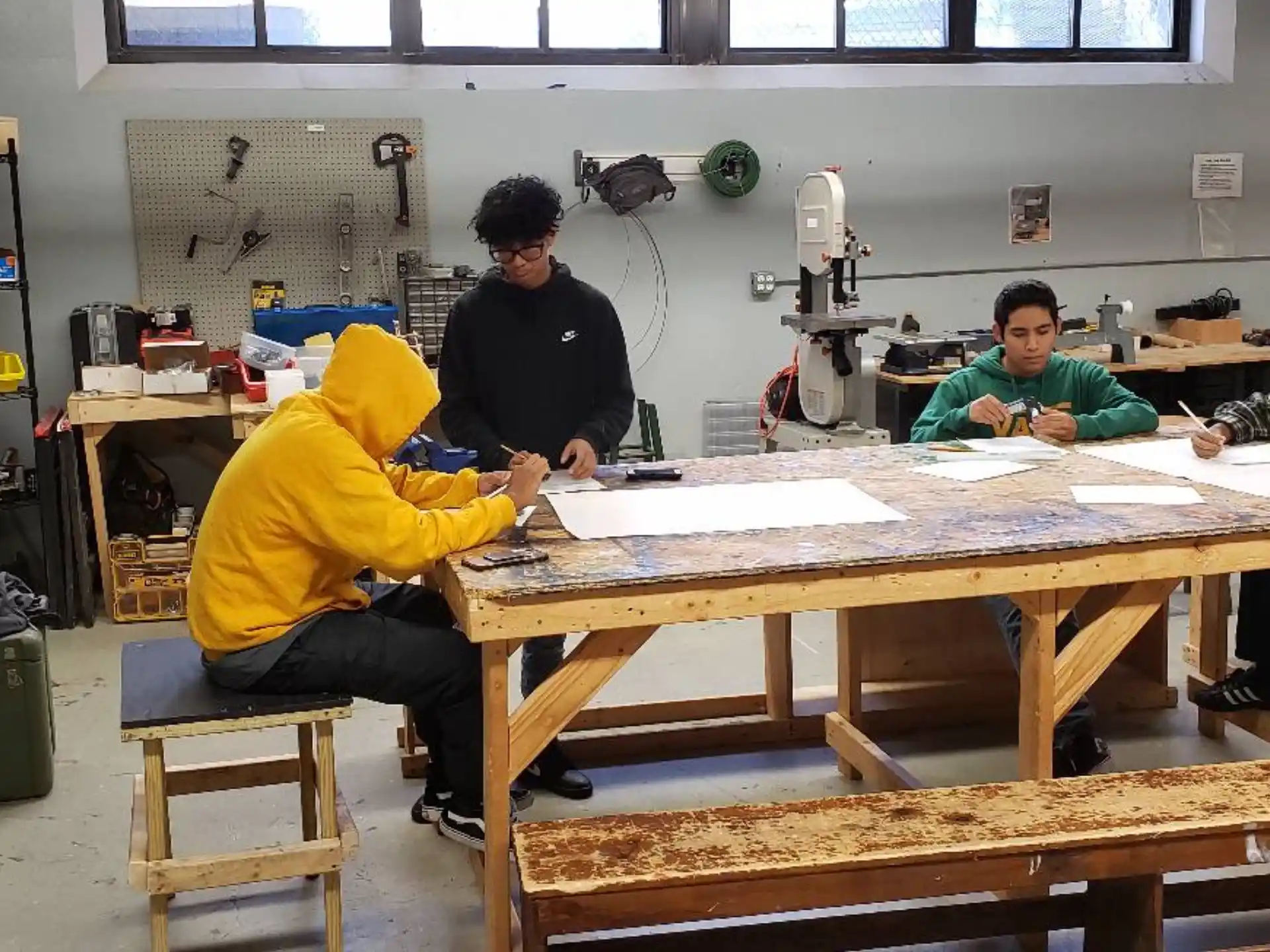 a group of men working on a table