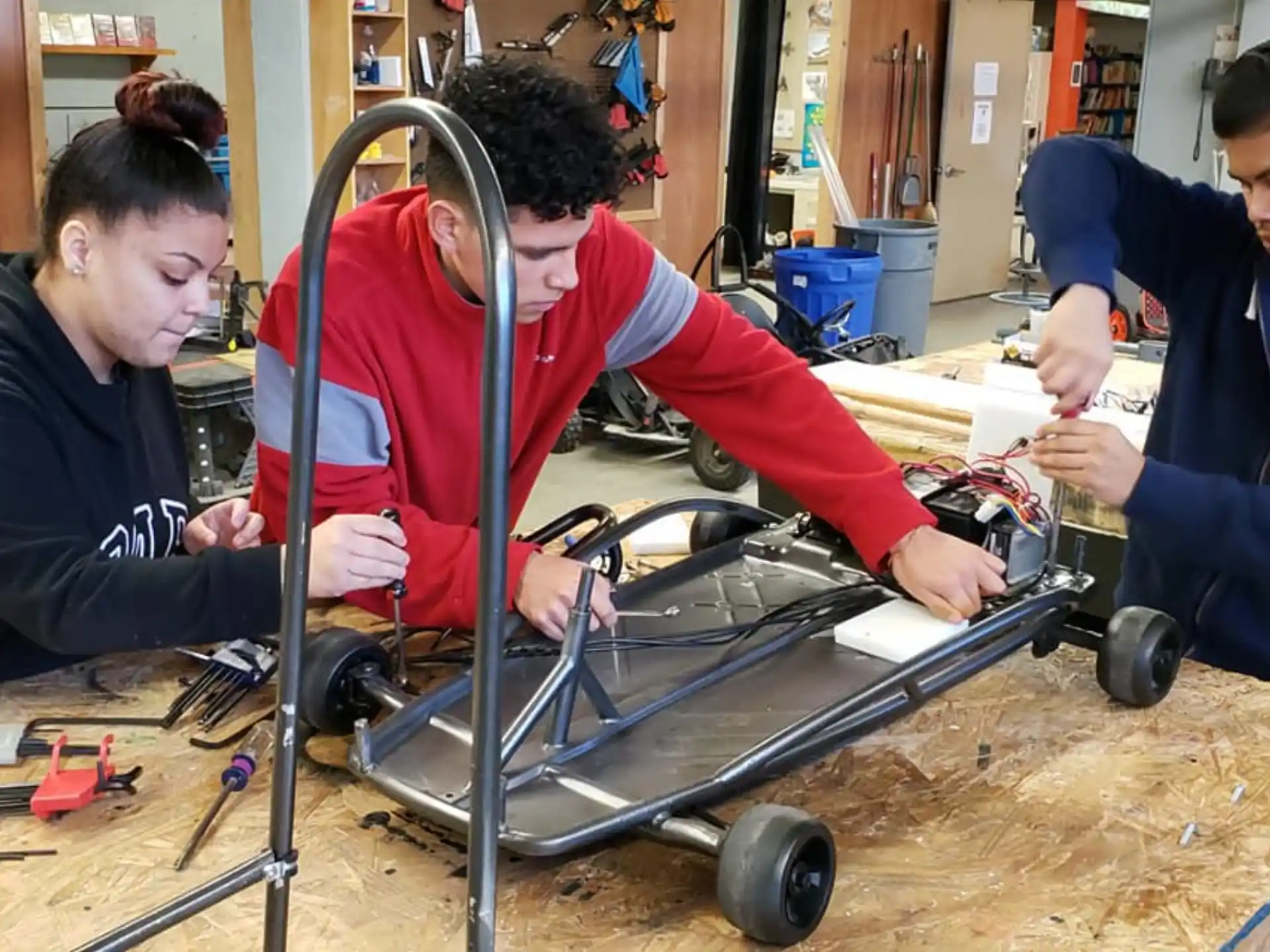 a group of people working on a car